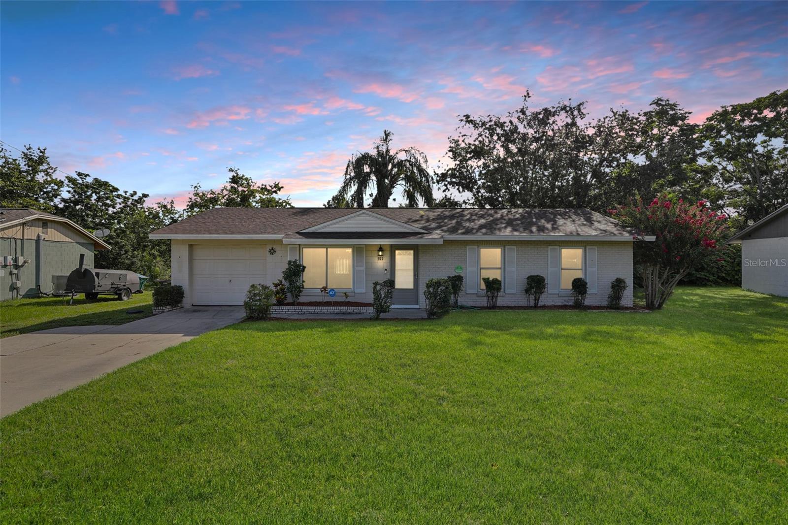 One or more photo(s) has been virtually staged. Love where you live—inside and out! This upgraded 3-bedroom home is packed with charm, fresh updates, and incredible outdoor space that makes Florida living feel like a dream. Whether you're relaxing under the palm tree on the back patio or cooking dinner in your newly updated kitchen, this home has everything you need.
Step inside to find a bright and welcoming layout, featuring an open living room that flows into the dining area—ideal for everyday life or weekend entertaining. The kitchen gleams with brand-new appliances. Two of the bedrooms feature NEW carpeting for extra comfort. A convenient laundry room, storm doors on the front and back, and a new roof (2022) round out the thoughtful upgrades that make this home move-in ready.
Outside, you’ll love the large backyard, tropical landscaping, and expanded patio, perfect for soaking up the sunshine or hosting your next BBQ. There’s even a storage shed for tools and toys, plus a new septic drain field for added peace of mind. With no HOA, a one-car garage, and plenty of room to park in the driveway, you’ll enjoy the freedom to live life your way.
Don’t miss your chance to own this slice of paradise—schedule your showing today!