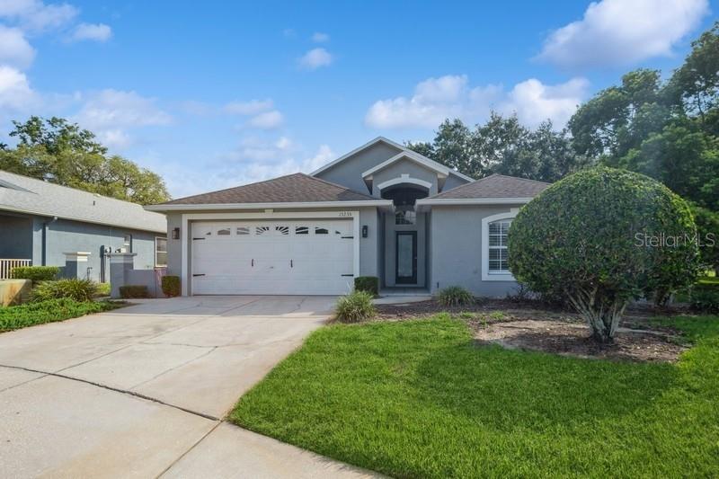 FABULOUS HOME ON GOLF COURSE ~ Move-In-Ready! This lovely residence is well-maintained and meets the desirable features of open concept design, cathedral/vaulted ceilings, Plantation Shutters Thru-Out, split bedrooms, tile flooring, plenty of overhead fans and a screen lanai for enjoying our beautiful Florida weather. The covered front entry is welcoming inside to the living room with a soaring cathedral ceiling, built-in entertainment center and seamless access to the lanai with gorgeous golf course views. A formal dining room and a breakfast nook flank the kitchen which is outfitted with stainless appliances, tile backsplash and a pantry. The private primary suite has a walk-in closet, a secondary wall closet and the en-suite bathroom features, raised panel cabinetry with a decorative sink and walk-in shower of tile and glass. The additional bedrooms are positioned on the opposite side of the home with a full bathroom to share. An inside laundry room is conveniently located. The lanai is a lovely space to relax or entertain, there’s access from the living room, as well as, the dinette offering a view of serene landscaping, shade trees and the golf course. This unique lanai has a covered seating area with ceiling fan and a birdcage screened area to star gaze or take in a little sunshine. This Meadow Oaks home perfectly blends comfort, style and a picturesque setting. The community features a lovely clubhouse, restaurant, pool and an array of amenities. Bicycle, stroll or cruise in your golf cart to experience the surroundings or enjoy the community 18-hole golf course at your leisure. This home is move-in ready and waiting for you. Close to the Suncoast Parkway for an easy commute to Tampa/ St. Pete. Schedule your visit today, you’re going to love it here!
