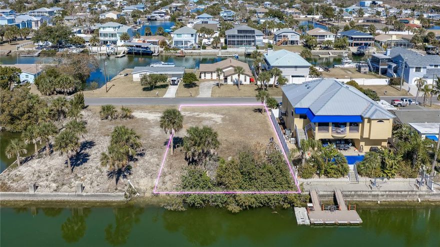 DIRECT GULF ACCESS!! 6,000 (60X100) waterfront lot on DEEP WATER CANAL that is ready for you to build your dream home! Property is located in a flood zone so any home constructed will need to be elevated. R1B zoning for a single-family home.  Located in the charming coastal town of Hernando Beach!! No Short-Term rental restrictions or deed restrictions. Outdoor enthusiasts will delight in the proximity to Weeki Wachee Springs, where they can enjoy swimming, kayaking, and exploring the natural beauty of this breathtaking area. Additionally, the surrounding area offers a variety of restaurants featuring live music and entertainment, as well as charming shops for leisurely strolls and unique finds. This sought-after location provides a peaceful retreat away from the hustle and bustle of city life, while still offering convenient access to nearby attractions and necessities. Don't miss the chance to own a piece of paradise in Hernando Beach and experience the ultimate coastal lifestyle! Water, sewer, and power connections are located at the street. (Please note that lot lines shown on aerials are approximate.) Property is on the right side of the Road before 4354 Tahiti Drive.