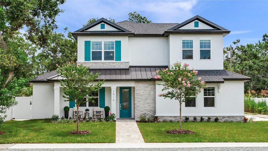 Experience the best of Gulfport living in this brand-new, high-and-dry construction, located in a no-flood zone and just a block from the vibrant downtown.  This spacious 4-bedroom, 4-bath home with a 2-car garage is perfectly situated on an oversized corner lot. Step into an entertainer's paradise with a spacious open floor plan centered around a magnificent ten-foot quartz kitchen island. Enjoy movie nights in your home theater, tackle projects in your dedicated home office, retreat to the convenient first-floor primary suite featuring a floor to ceiling spa-inspired wet room, or host guests in the two upstairs en-suite bedrooms. Outside, a sparkling custom saltwater pool provides the perfect oasis. With multiple parks, Boca Ciega Bay, and an array of restaurants all within walking distance, your lifestyle options are endless. Start your day with coffee on the front porch and end it with an evening dip in your custom pool by the covered lanai.