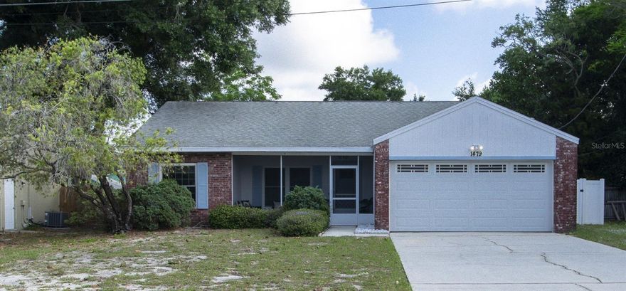 Meticulously maintained by its owner for 30 years, this charming 3BR/2BA/2-car garage home offers 1,107 sqft of pristine heated living space (1,881 total sqft). Step inside to a bright, open main living area with soaring vaulted ceilings. The fully equipped kitchen features a refrigerator, range, microwave, dishwasher, and disposal, opening to a traditional split floor plan. The primary suite is privately tucked away, while two additional bedrooms provide the perfect layout for a dedicated office and a guest room. French doors lead to a large screened porch and a massive, fully fenced backyard oasis. Extra perks include new carpet in all bedrooms and a reverse osmosis system.  Nestled in a quaint, close-knit neighborhood just minutes from downtown Palm Harbor shops, restaurants, First Fridays, the Pinellas Trail, and Wall Springs Park. Zoned for highly desirable Palm Harbor University HS. Turnkey peace of mind! SELLER WILL INSTALL A NEW ROOF PRIOR TO CLOSING!  This home comes with a 13 MONTH HOME WARRANTY for buyer's Peace of Mind and to help make transitioning easier!