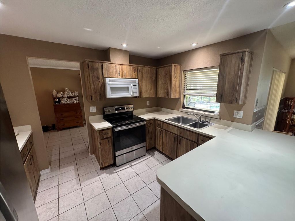 Photo of 2148 Waterfall Drive, Spring Hill, FL 34608 (MLS # W7881987)