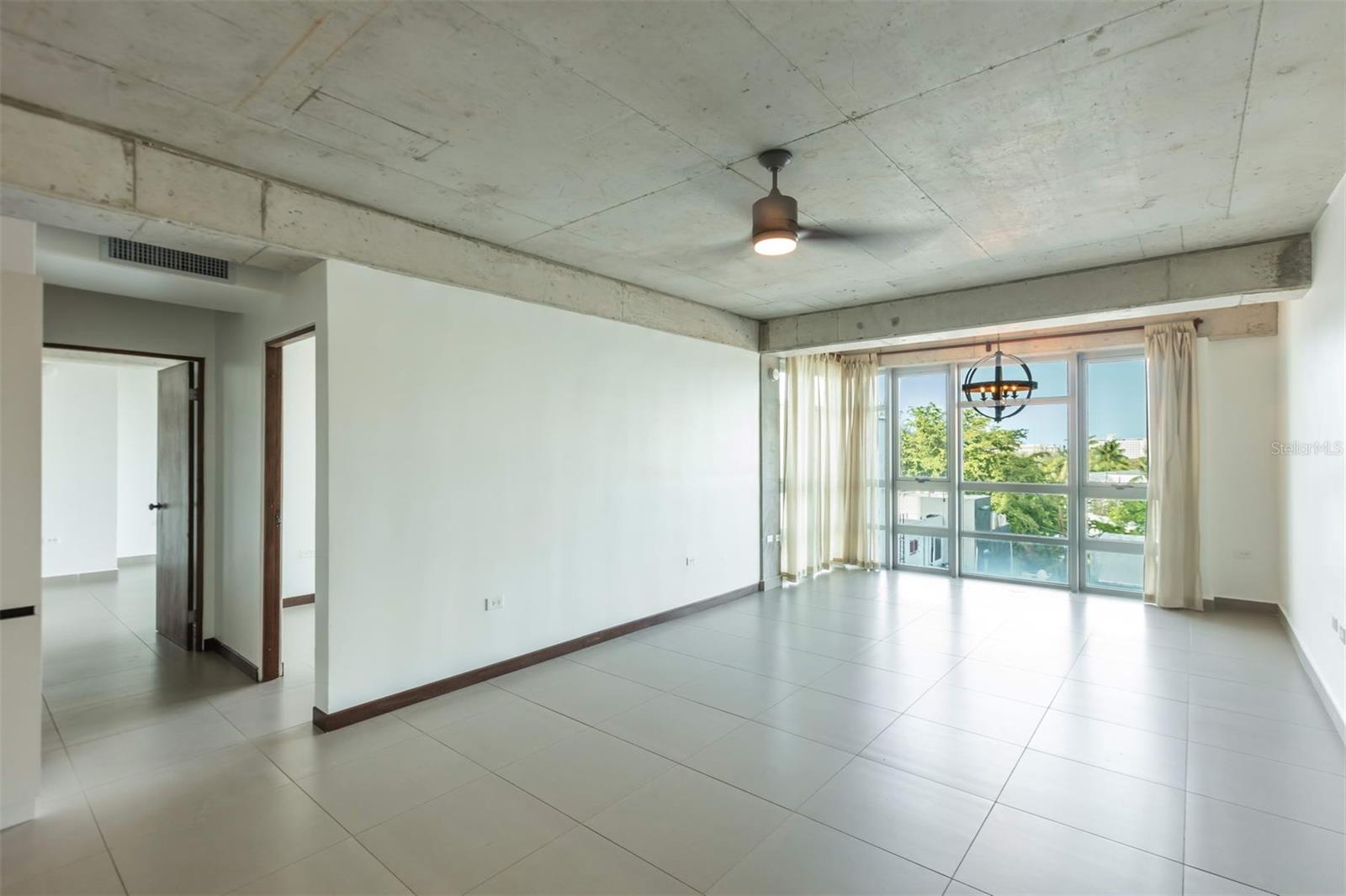 The only available 2-beds 2-baths residence on sought after Atlantis Condominium, featuring open concept living, including a spacious kitchen with stainless steel appliances, a family room and dining area. The primary suite includes a large area that fits a king size bed comfortably, window treatments, a walk-in closet and remodeled bathroom with double vanities. The secondary room is perfect for guests, as a nursery or home office. An abundance of natural light fills the spaces through the floor to ceiling windows, with lagoon and city views.
Residents of Atlantis benefit from premium amenities, including 24/7 security and concierge, fitness center, business room, full power generator, water cistern, three elevators, and visitor parking.
Centrally located steps from the beach, park, renowned dining and nightlife, coffee shops, and exercise trails. Just minutes by car or Uber to Condado, Miramar, Old San Juan, Santurce, and Distrito T-Mobile.
Set up a private showing today!