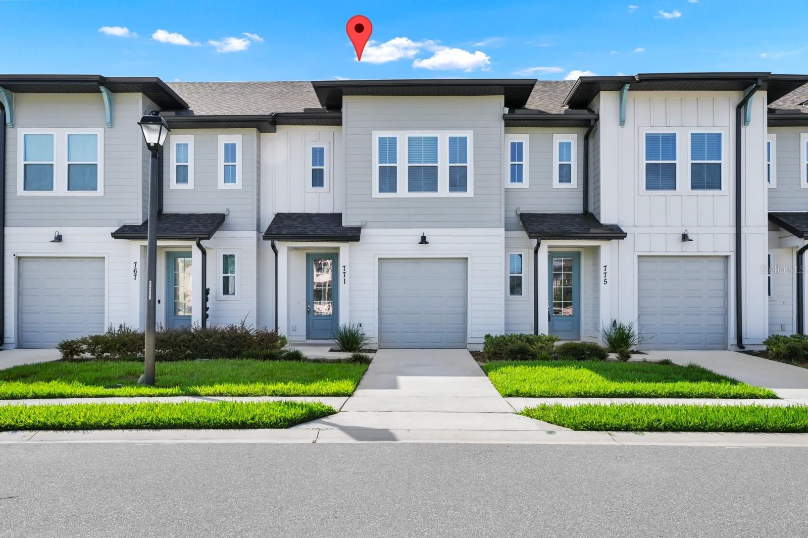 Welcome to The Enclaves at Festival! This Gorgeous, like new town-home located in the highly desirable, Champions Gate area. This beautiful home has a sunny bright, open kitchen with plenty of upgrades such as beautiful 42 inch cabinets, all stainless steel Whirlpool appliances including gas range, dishwasher, microwave. Enormous island with Quartz counter perfect for gatherings that is open to the great room and dining area. Main living space on first floor features wood look luxury plank flooring throughout and bedrooms with upgraded high-end luxurious stain resistant carpet for comfort. Enjoy the resort style amenities with a swim in the beach walk-in community pool, Splash Pad water park, fitness center, 18 hole miniature golf, and beach volleyball court all approximately 1/4 miles away. This home is conveniently located to shopping, grocery stores, Posner Park, Champions Gate Village, Walt Disney World and Loughman Elementary School is right around the corner. The home utilizes energy efficient construction such as double pane Low-E vinyl windows, programmable thermostat, fresh air intake, water saving low flow plumbing fixtures, natural gas, R-30 ceiling insulation, LED lighting and more. SHORT TERM RENTAL IS ALLOWED!