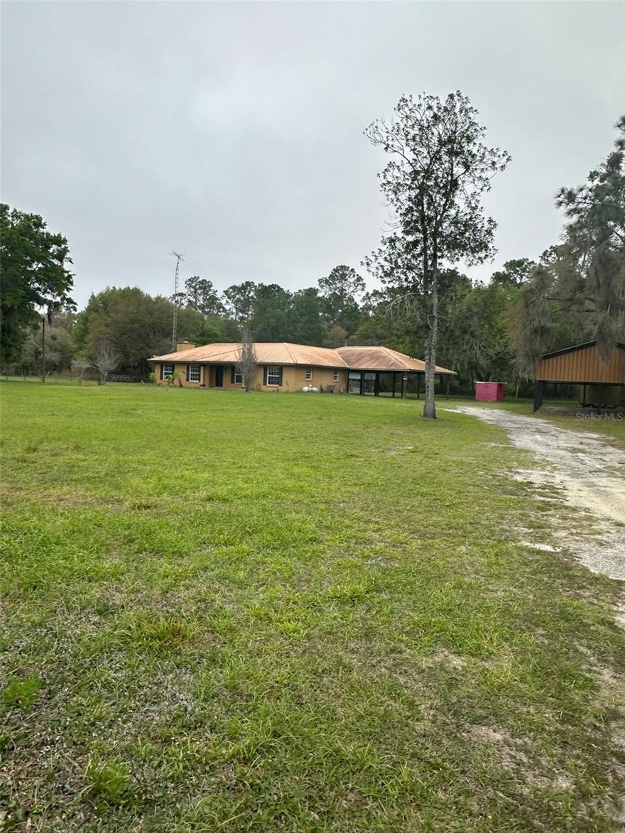 Are you looking for Peace & Quiet, great private property, Country living at its best  on 2.27 gated and fenced acres! This 3BR/2BA home with approx. 1,890 sq ft with great potential. Two Bonus Rooms!!!!!   Property features a 4-stall barn, paddock, 2,000 sq ft pole barn (5 bays), RV parking, 1,700 sq ft covered patio/carport, and storage shed. Zoned A-1—bring your horses, livestock, and toys. Home includes multiple living areas. Great opportunity to create your ideal mini farm!