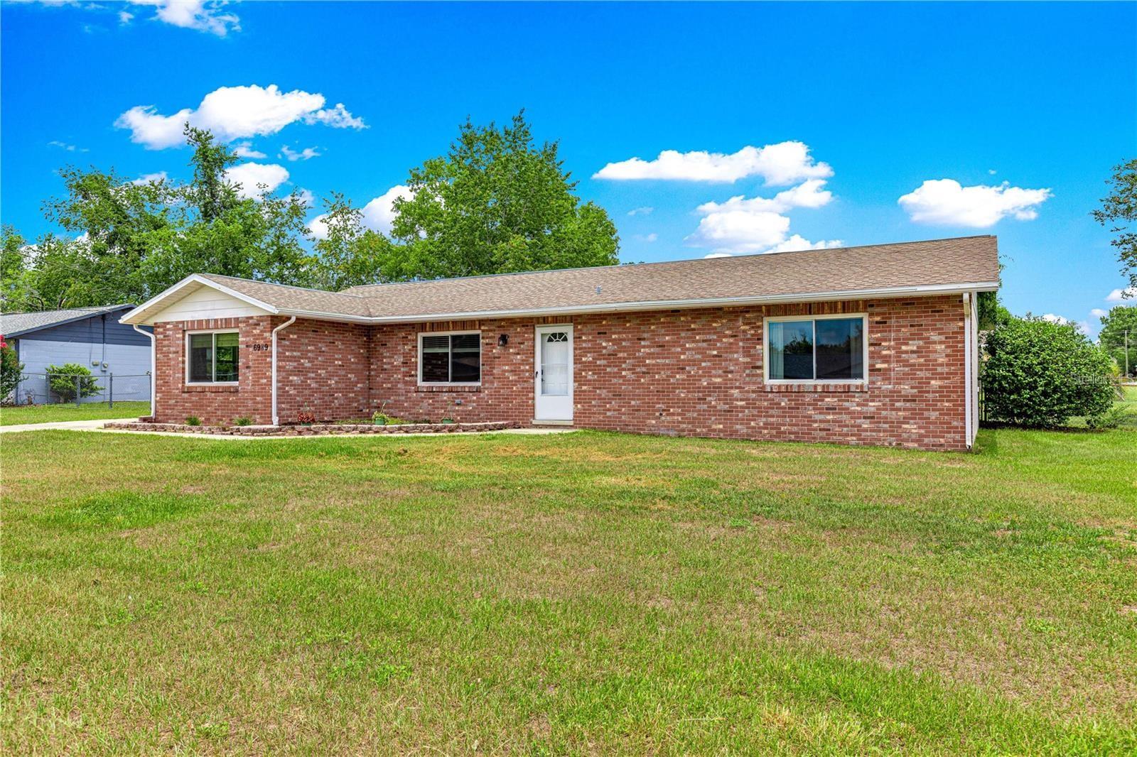 Welcome to This Beautiful 4-Bedroom, 2-Bathroom Home on a Corner Lot with Fantastic Outdoor Space! Located in the Florida Heights neighborhood, this spacious home offers room to spread out both inside and out. Step into a bright and inviting living room, complemented by a separate family room featuring a cozy brick fireplace – perfect for relaxed evenings or casual entertaining. The large kitchen is a chef’s dream, complete with a center island, built-in wine rack, ample cabinet space, and an enclosed pantry. There’s plenty of room to prep, cook, and gather with loved ones. Adjacent to the kitchen is a dedicated inside laundry room for added convenience. The primary bedroom serves as a quiet retreat and easy access to a private, efficient en suite bathroom with a walk-in shower. Three additional bedrooms provide flexibility for guests, home office, or hobbies. Step outside to enjoy Florida living in the fenced backyard, ideal for pets, play, and privacy. A sandy fire pit area sets the scene for cozy nights under the stars, while the patio is ready for grilling or gatherings. A storage shed offers 50amp electric service and adds practical outdoor storage, and the corner lot gives you just a little more breathing room. This well-maintained property offers comfort, charm, and functionality and NO HOA all in one, HVAC replaced in 2018, Water Heater Replaced in 2018– come see what makes it feel like home!