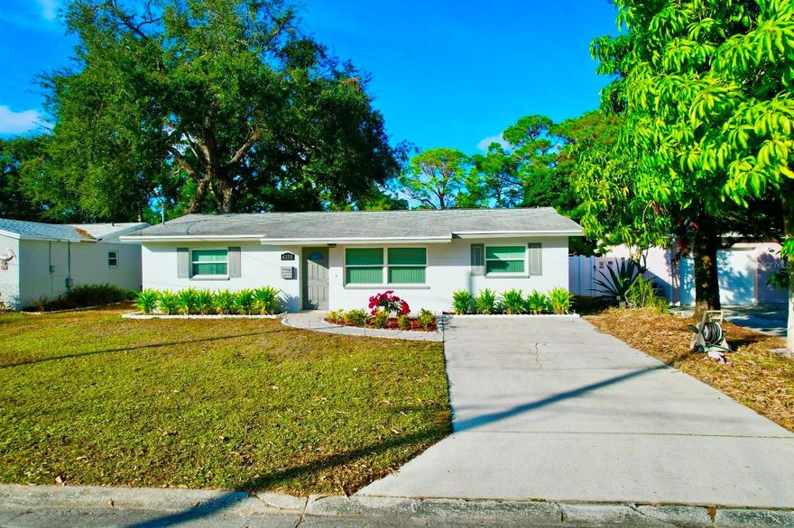 This beautifully renovated, move-in-ready 4-bedroom, 3-bathroom, and full 2-car garage home offers exceptional quality in a prime central Pinellas County location.  The residence is split to allow flexible living, providing in-law-style accommodation or even potential rental income!

Thoughtfully and fully updated within the last five years, the property was designed with efficiency in mind—making it a rare turnkey opportunity. In a NO flood-zone, this home is fully hurricane-ready -- featuring a 2017 50-year dimensional shingle roof with upgraded peel-and-stick water protection and backed by a transferable lifetime warranty. Comfort is ensured with a 2024 central heat and air system for the main house and a recently serviced secondary system for the bonus room and third bath.  Impact-rated PGT large-missile windows, shutter protection at the front door, and an insulated metal garage door provide superior storm protection and qualify for insurance discounts. All of the big-ticket items have been taken care of, so you can enjoy long-term peace of mind.

The interior offers a highly versatile layout with three full bathrooms and two separate entrances, including a main entry on 72nd Terrace and rear access on 73rd Avenue. An approximately 300 sq. ft. bonus room with a full bathroom and private entrance is ideal for guests, a home office, multi-generational living, or potential rental use. Stunning wood-look ceramic tile flows throughout the home, complemented by solid-wood interior doors, LED lighting, new Sledge & Keswick door handles & deadbolts, and designer ceiling fans.  The kitchen and baths all feature exquisite granite countertops, luxury tile, Kohler fixtures and toilets, and updated lighting with vented exhaust fans. The kitchen includes LG appliances, a newer dishwasher, microwave, washer/dryer, USB outlet at the bar, and a top-of-the-line garbage disposal. Electrical upgrades include a 200-amp Square D panel, updated outlets and switches throughout, and GFCIs in required areas. Additional improvements include a whole-house water filtration system and new plumbing shut-off valves at every sink and toilet. The garage offers a fire-rated entry door, kitchen access door, utility sink, a second washer/dryer hookup, an 80-gallon water heater, and a new double-coated epoxy floor. Outside, the home continues to impress with recently painted and sealed interior and exterior surfaces, decorative exterior lighting, motion-activated floodlights, and new front landscaping with solar-lit walkways and reclaimed water service. A new PVC privacy fence with a double rear gate allows easy RV or boat storage and provides ample space for a future pool or spa, along with additional fenced storage. 

Centrally located, the home offers quick access to I-275 and is just minutes from downtown St. Petersburg, Tampa International Airport, St. Pete–Clearwater International Airport, shopping, dining, parks, schools, and essential services.  All of this, and still just a 15-minute drive to the pristine Florida Gulf beaches. Homes offering this level of renovation, flexibility, and location rarely come available. Schedule your private showing today.