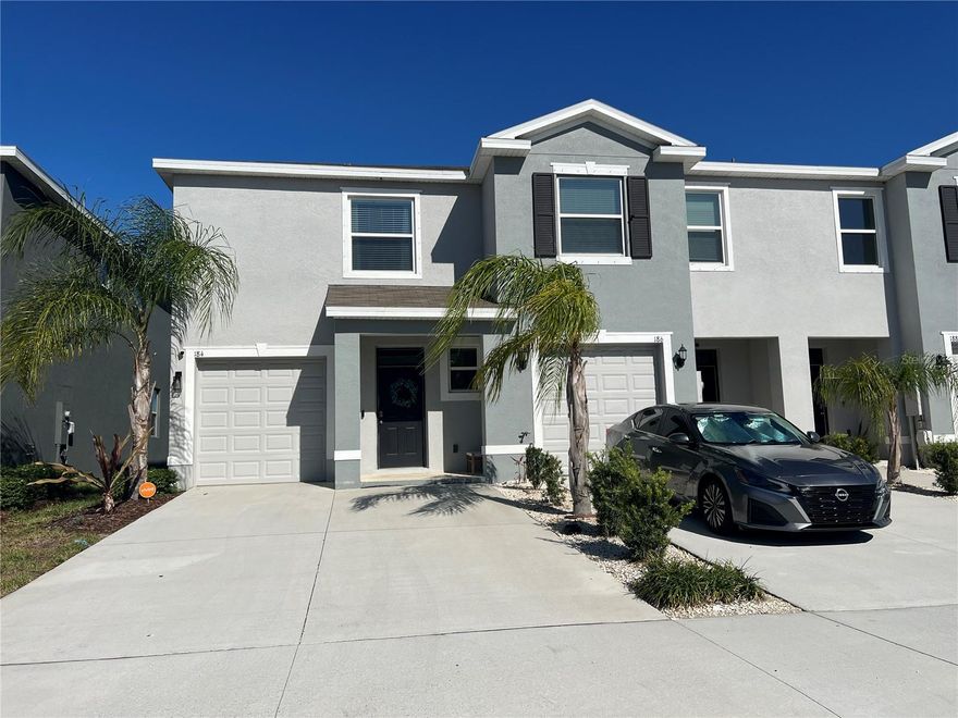 This move-in-ready home is located 30-minutes south of Tampa. Step inside to find an inviting open-concept layout with a modern kitchen featuring granite countertops, stainless steel appliances, and a spacious island perfect for entertaining. The living and dining areas flow effortlessly onto a private screened lanai, where you can unwind to a beautiful sunset. Thoughtful upgrades include a farmhouse sink, and an enclosed lanai. This corner unit affords additional privacy. The upstairs layout offers a versatile loft, split bedrooms for privacy, and a generous primary suite with a walk-in closet and en-suite bath. Mangrove Point residents enjoy low-maintenance living with HOA fees covering water, garbage, and lawn care—plus access to a sparkling community pool, walking trails, and more. Located in a non flood zone area, no secondary flood insurance required! Conveniently located just minutes from I-75, Hwy 41, and Apollo Beach’s waterfront dining, shops, and marinas, you’ll love the lifestyle this home offers. Don’t wait—schedule your private showing today!