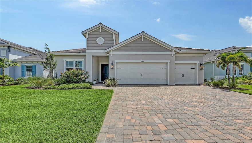 This meticulously enhanced three-bedroom, three-bathroom residence—with a versatile den easily convertible into a fourth bedroom—boasts 2,520 square feet of living space in the sought-after Avelina community of Wellen Park. With up to $92,000 in builder design and structural upgrades, plus premium owner-selected finishes, this home seamlessly blends luxury, practicality, and intentional design.
The open-concept layout welcomes you with vinyl plank flooring, custom window treatments, and an abundance of natural light. The chef’s kitchen is a true centerpiece, featuring quartz countertops, high-end appliances, undermount lighting, and ceiling-height luxury cabinetry that offers exceptional storage and style, all soft-close drawers.
Adjacent to the kitchen is a great room with soaring tray ceilings, seamlessly flowing into a massive, covered patio—perfect for entertaining. The patio is pre-plumbed for an outdoor kitchen and sink, and includes a pool pre-wire package, making it easy to create your dream outdoor retreat.
The primary suite is a sanctuary, highlighted by a huge walk-in closet with custom high-end shelving—a favorite feature of the current owner. Each bathroom is thoughtfully designed, and the laundry room adds convenience with built-in cabinetry, a laundry tub, and Corian countertops.
Additional features include hurricane impact windows, pocket sliders, and elegant lighting fixtures throughout. Located in a maintenance-free, close-knit community, this home offers the perfect blend of comfort, sophistication, and Florida lifestyle.
This stunning home is located in the heart of Wellen Park, where wellness and community come together in one of the most desirable neighborhoods. Enjoy access to miles of walking and biking trails, serene lakeside views, and wellness-focused amenities like yoga lawns, fitness centers, and outdoor gathering spaces. Just steps from Downtown Wellen and CoolToday Park, this home offers the perfect balance of relaxation, recreation, and vibrant living.
