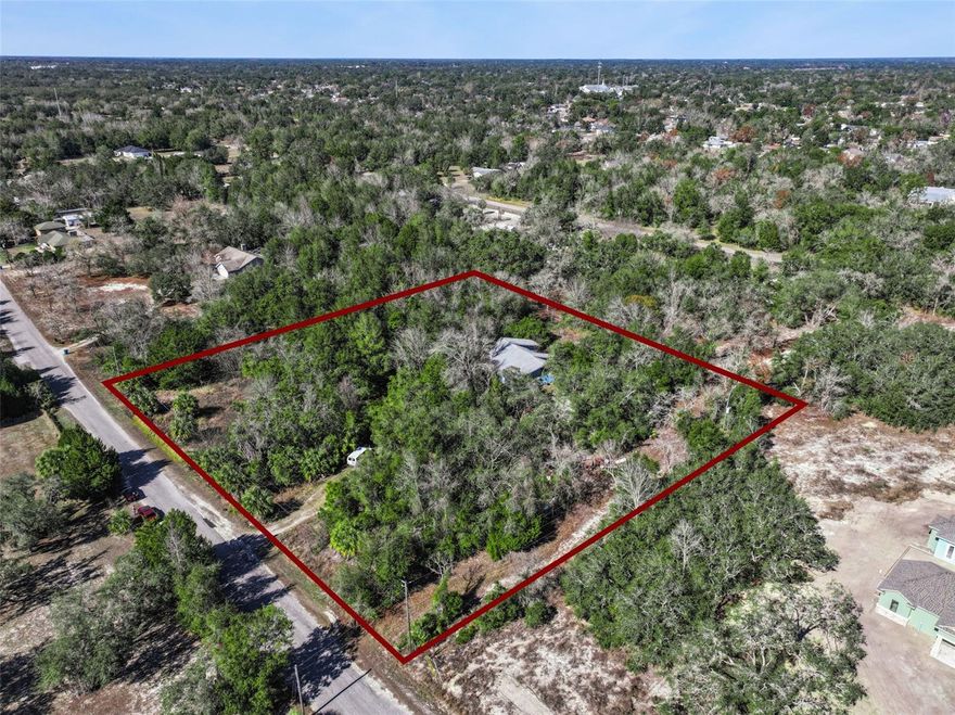 Discover a prime 2.4-acre homesite in Spring Hill, Florida, surrounded by an area experiencing rapid new construction and growth. This property already features electricity and a septic system, significantly reducing upfront costs and making it an attractive option for anyone looking to build without the expense and delay of starting from raw land. Enjoy the space, privacy, and flexibility that the acreage provides while still  being close to everyday conveniences. With acreage like this becoming increasingly scarce, opportunities like this are limited. The seller is motivated and open to all reasonable offers, making this an excellent chance to secure a desirable piece of land before it is gone.