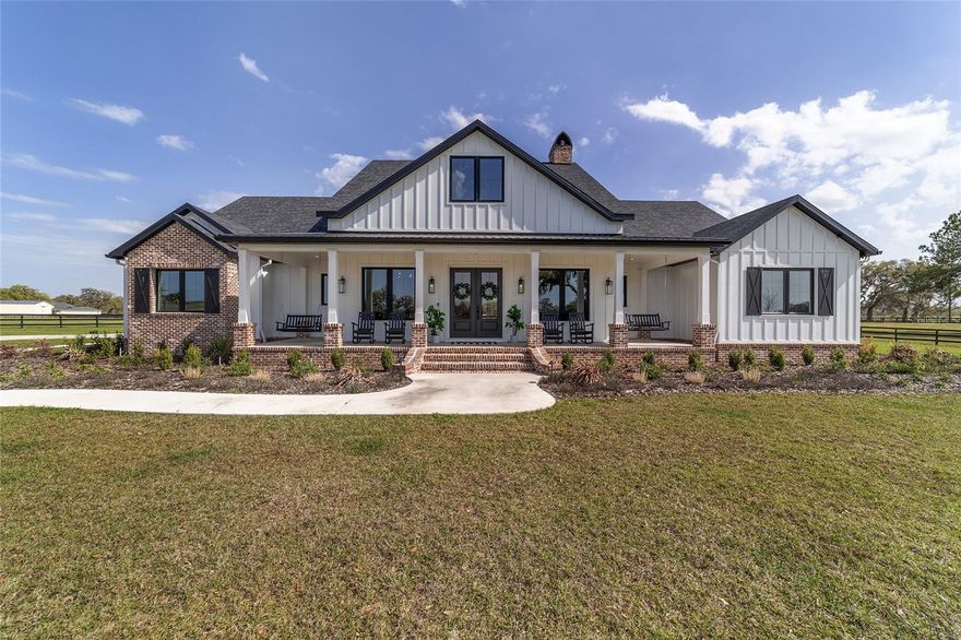 Discover your dream home with this luxurious estate built in 2023, set on a serene 13.33-acre lot gated and fenced at the end of a cul-de-sac. Surrounded by beautiful large oak trees, this property offers breathtaking sunsets and sunrises.  The estate features 3 spacious bedrooms, 3 1/2 baths, a game room with a golf simulator, and a dedicated office space.  The gourmet kitchen is equipped with a double oven, high-end appliances, a pot filler, quartz countertops, and a large walk-in pantry.  Additional offerings include a mud room, vaulted ceilings, and a cozy-wood burning fireplace.  Outdoor amenities include a pool and heated spa, an outdoor entertaining are with cabinets and countertops, and a fire pit.  For equestrian enthusiasts, the property boasts a 4-stall concrete barn with a tack room and wash rack.  Storage and utility needs are met with an enormous 42ft x 80ft x 16ft detached storage garage featuring two 14ft x 14ft overhead garage doors.  The estate is equipped with 2 A/C units, a 1000-gallon buried gas tank, and Icynene insulation for energy efficiency.  Security cameras provide peace of mind.  This estate is perfect for those seeking luxury, privacy, and the beauty of nature.  Don't miss the opportunity to own this exceptional property.  Contact us today for a viewing!