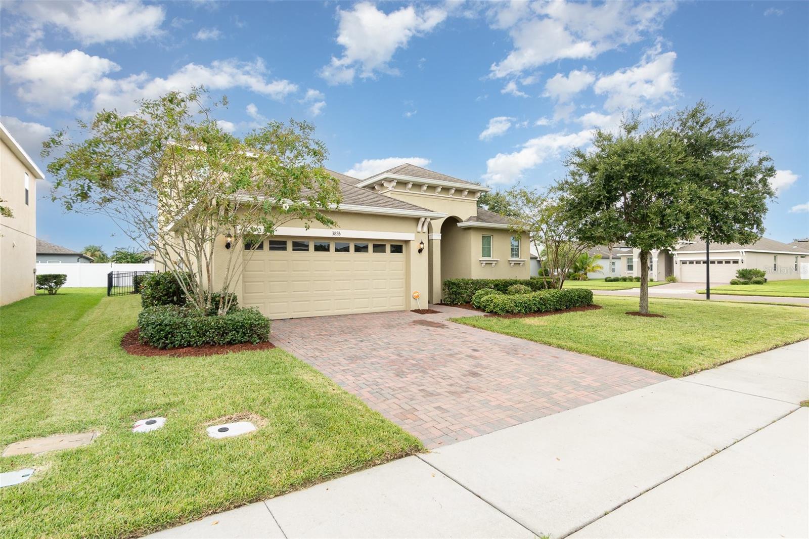 Welcome to the desirable gated community of Wynham Preserve! This beautifully upgraded Walton II model features 5 spacious bedrooms and 3 full baths, including a main-floor primary suite plus a second master upstairs—an ideal setup for multigenerational living or flexible use. The chef’s kitchen is sure to impress with 42” espresso cabinets, granite countertops, stainless steel appliances, a walk-in pantry, center island with sink, pendant lighting, and a striking herringbone tile backsplash. Granite countertops extend into all three baths, with the primary bath offering a luxurious walk-in tiled shower. Additional highlights include upgraded lighting, ceiling fans in most rooms, and elegant tile flooring in the main living areas. Outdoors, the fully fenced backyard with sleek aluminum fencing provides both privacy and style for everyday enjoyment. Perfectly located just minutes from major highways and Sanford International Airport, this move-in ready home truly has it all. Don’t miss out—this one won’t last!