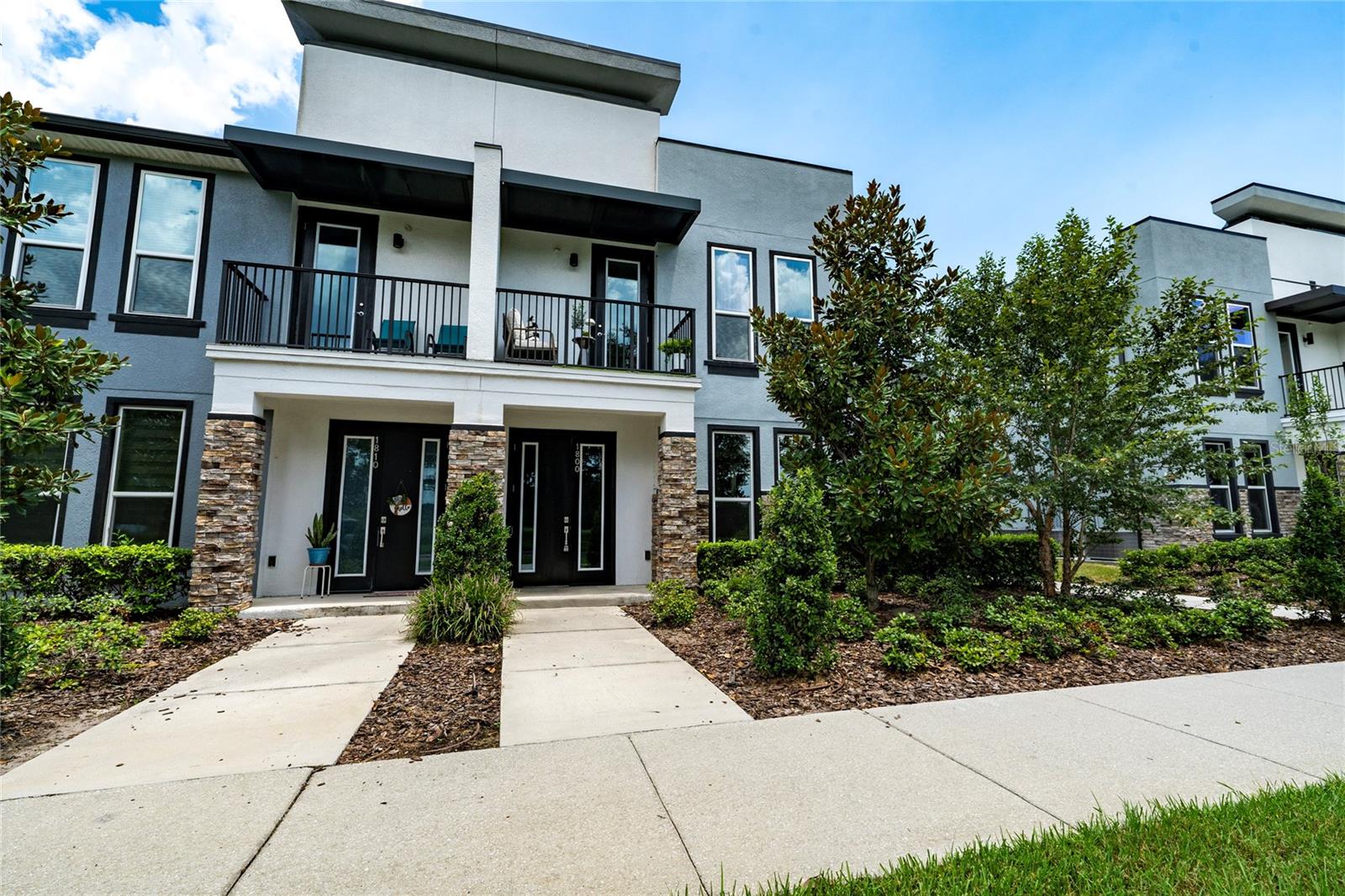 Welcome to the only corner-unit townhouse available in the highly desirable Soho at Lakeside community! Formerly the model home, this property is packed with premium finishes and exclusive details. The home features three spacious bedrooms on the second floor, along with two full bathrooms. A convenient powder room is located on the first floor for guests.
The interior boasts a modern kitchen with European-style cabinets, quartz countertops, and stainless steel appliances. Energy-saving double-pane windows flood the home with natural light while helping reduce energy costs. Wood-like tile flooring combines durability with elegance, and the 9-foot ceilings with extra-tall windows create an open and airy atmosphere. Enjoy your own private balcony, perfect for relaxing or entertaining. The spacious two-car garage offers additional storage, and the second-floor laundry room for added convenience.
This community offers resort-style amenities, including a sparkling pool for relaxation and a dedicated dog park for your furry friends. Located just a short stroll from Mark Durbin Community Park, where you’ll find tennis courts, basketball courts, a soccer field, picnic areas, and barbecue grills. Downtown Kissimmee is only a 10-minute drive away, offering a wide array of shops, restaurants, and entertainment. The property is also conveniently located near Valencia College, Neo City, and Osceola Heritage Park.
This property combines elegance, functionality, and a fantastic location. Don’t miss this rare opportunity to own a spacious corner unit with luxurious amenities in the thriving Soho at Lakeside community. Contact us today to schedule your private showing!