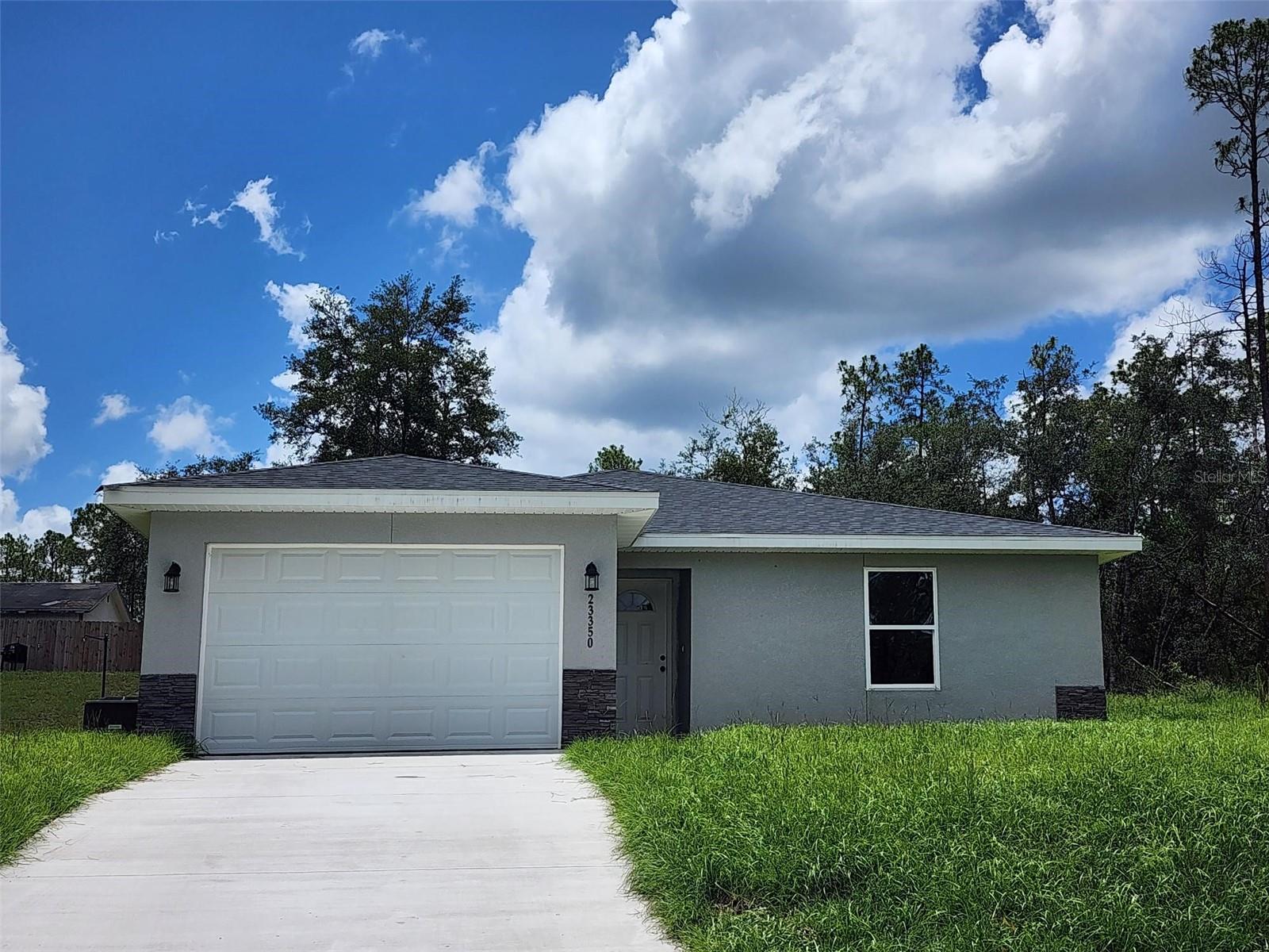 New Construction 3 bedroom 2 bath Home Located in the up and coming neighborhood of Rainbow Lakes Estates just 30 minutes west of Ocala, 15 minutes from Downtown Dunnellon, and 30 minutes from the Gulf Coast town of Crystal River. This home's upgrades include Stainless Steel Appliances, All Wood Cabinets with soft close hinges, Granite Countertops in Kitchen and Baths, Tile Shower and bathtub wall, Luxury Vinyl Plank Flooring throughout, and one and a half car garage with garage door opener. Love the Community you live in! Rainbow Lakes Estates offers a Community Center and a Recreational Park which include playgrounds, tennis courts, racquetball courts, basketball courts, baseball field, walking trails, a boat ramp to Tiger Lake, and picnic pavilions. Rainbow River and Rainbow Springs are part of Marion County's Top outdoor attractions and are only a short 10 minute drive from Rainbow Lakes Estates. Enjoy the crystal clear water for kayaking, tubing and outdoor fun. Play a round of golf just 10 minutes away at Nationally recognized Juliette Falls Championship Golf Course. Whether you enjoy outdoor activities and adventure, or prefer to relax and enjoy the beauty of nature, you'll love calling Rainbow Lakes Estates your home.