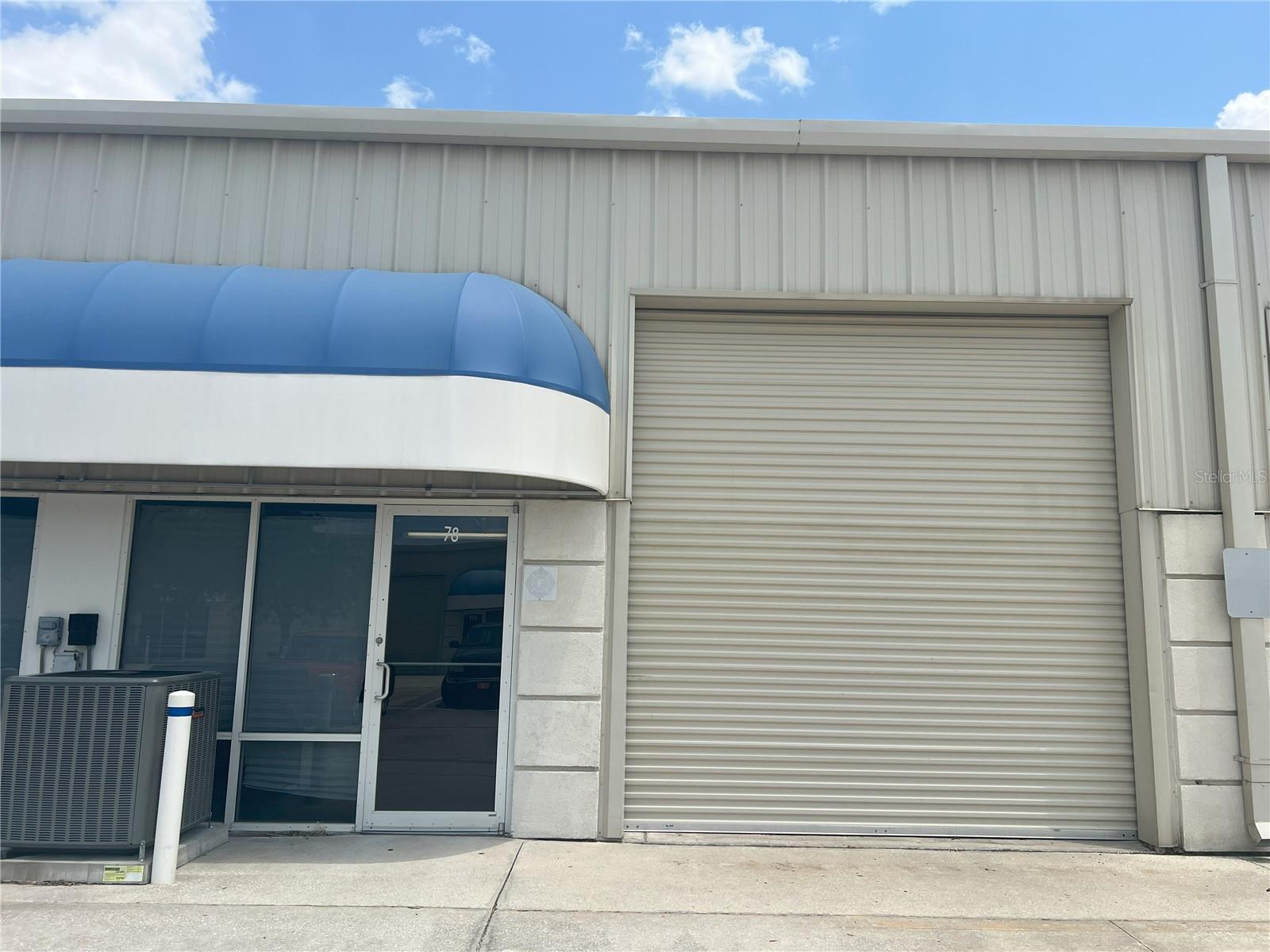 Industrial condominium unit 78 with glass front, glass entry door and roll-up door. 1000 SF unit with 200SF office and 800 SF warehouse along with second-floor 400 SF mezzanine office. The unit features high ceilings, ADA restroom and full air conditioning. Centrally located in Flagler County. Minutes to SR 100 and Palm Coast Pkwy via US-1. Excellent location for office, retail, building trades, showroom, etc. Automotive services not permitted per condominium rules. Tenant responsible for sales tax, interior maintenance, utilities, and HVAC maintenance contract.