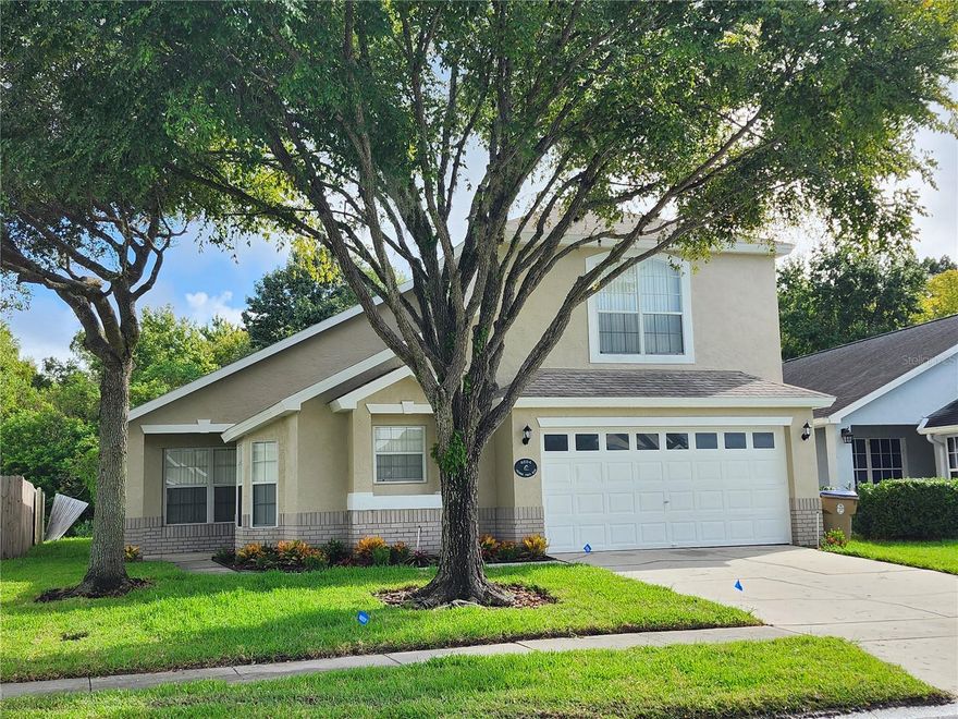 This home has been completely renovated and is ready for a new owner!  It is one of the largest homes in this community boasting 2209 sq. ft. of living area, so there's room for everyone!  With 2 master suites downstairs and a huge master suite on the 2nd floor, there are 3 master suites, making a total of 5 bedrooms with 4 full baths.  The house has been re-piped, repainted (inside, outside & garage), Vinyl plank driftwood flooring throughout the house (including bathrooms), carpeting on the stairway, & all bathrooms have been retiled over the tubs & in the showers.  New kitchen cabinets with crown molding, new bathroom vanities, all new kitchen appliances (including a built-in air fryer in the oven), new lighting fixtures, & nicely landscaped. There is a covered lanai as you go out to the screened-in pool, with a beautiful view of the conservation area and a pond view to the left.  There is a video doorbell and a video camera on the lanai so you can monitor the front & back.