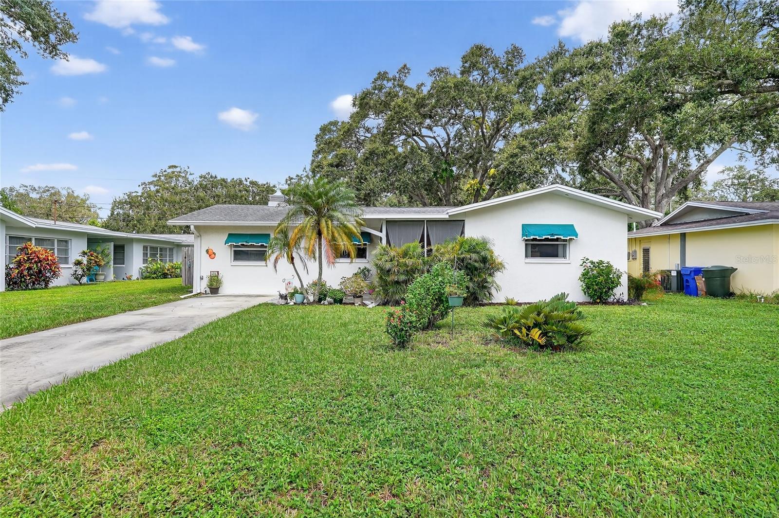Welcome to this beautifully updated three-bedroom, two-bathroom home in the heart of Dunedin. Thoughtfully maintained and move-in ready, this property offers peace of mind with a 2024 AC unit, a 2021 electric panel, and a 2021 remodel of the kitchen and bathrooms. There is even an alleyway behind the property with gate access for an RV or boat! The exterior was freshly painted in 2020, along with the addition of a screened-in front porch, while the interior was painted in 2021, giving the home a clean and inviting feel. Step inside to find wood-look tile flooring that flows throughout the spacious living and dining room combo. The light and bright kitchen features matching appliances, plenty of cabinet space, and a convenient coffee bar, making it perfect for both everyday living and entertaining. The primary suite includes a private attached bathroom, an additional AC unit for comfort, and even a laundry room tucked inside for convenience. Two additional bedrooms are nicely sized and share a full bathroom with an updated vanity and mirror. Sliding glass doors lead to the back lanai, the ideal spot to enjoy Florida’s sunshine year-round. Outside, the fenced backyard offers a patio for grilling, a storage shed for gardening tools, and a large yard with plenty of space for outdoor activities. This home is not only charming but practical as well, located in a no-flood zone and no-evacuation zone. Zoned MF-7.5, with no years of ownership required before leasing, making it an excellent opportunity for both homeowners and investors. The location can’t be beat; just a short walk or golf cart ride to downtown Dunedin’s restaurants, shops, breweries, and waterfront parks, with Mease Dunedin Hospital and TD Ballpark, home of the Toronto Blue Jays, only minutes away. Schedule your showing today!