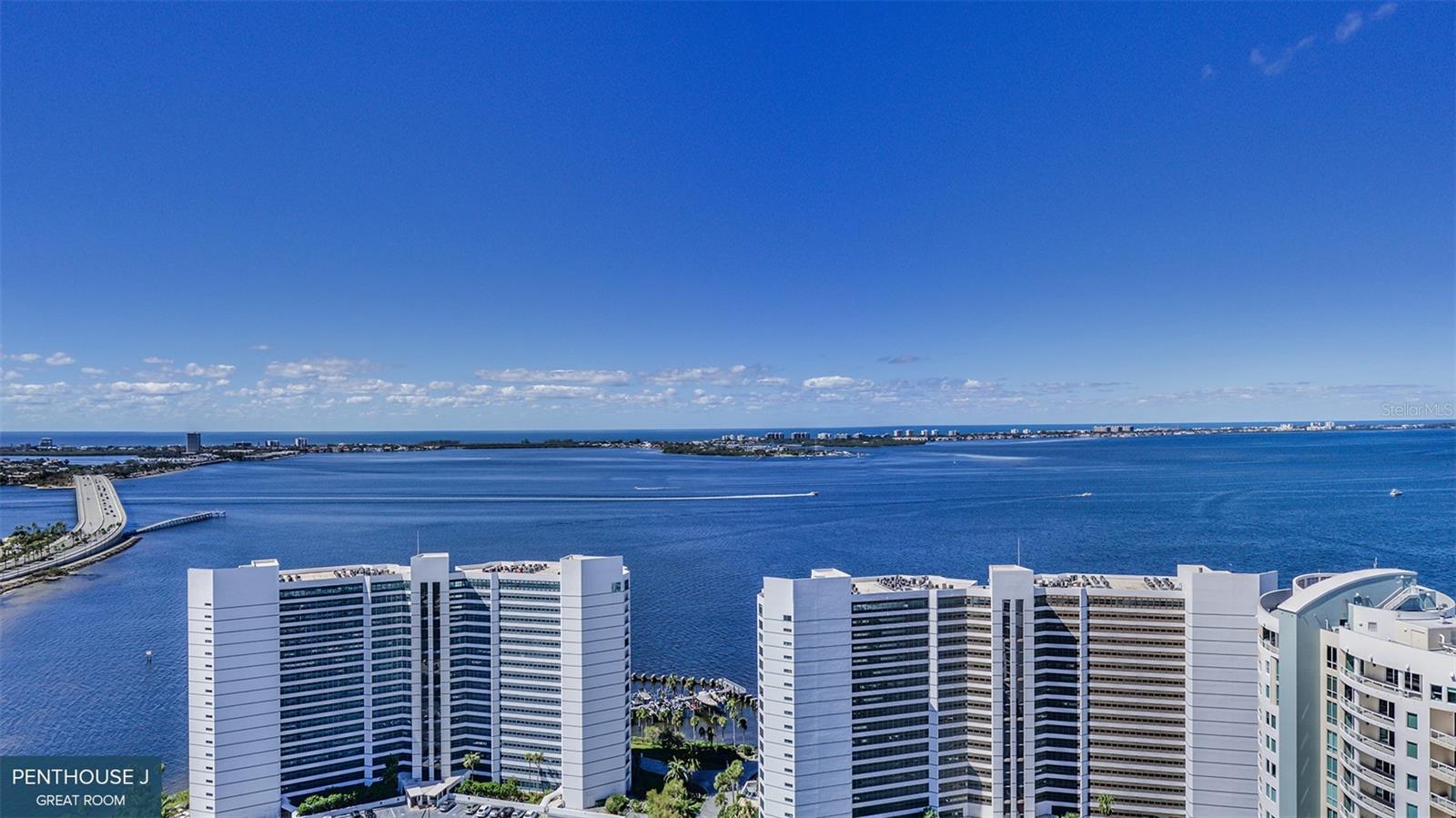 One or more photo(s) has been virtually staged. Pre-Construction. To be built. This 20-story Ritz-Carlton Residences tower enjoys a prime waterfront location in the heart of Sarasota's walkable downtown cultural district. Penthouse 2004 with 13-foot ceilings is at the north end of the tower and optimizes beautiful vistas of Quay Harbor, The Bay Park, Sarasota Bay and Gulf of Mexico. Its impressive Residence E design features soaring walls of glass that create an expansive and luxurious great room experience. This spacious area is accentuated by a wraparound terrace with a summer kitchen. The primary bedroom offers a breathtaking bay view through dramatic, oversized windows, complemented by two generous walk-in closets. The spa-style bath boasts a deep soaking bathtub, a double shower and double vanity. Additionally, two guest bedrooms each come with private en-suite baths and access to a separate para east-facing wraparound terrace. In The Ritz-Carlton global tradition of peerless service, this private residence will enjoy a dedicated on-site team that takes pride in anticipating every need and fulfilling every wish. A 24-hour dedicated staff and concierge, food and beverage services available from private, on-site service kitchen, dedicated 24-hour valet, housekeeping services and an impressive array of private amenities overlooking the sparkling yacht harbor. In addition to the exceptional private amenities and services available exclusively to our tower residents, membership in The Harbor Club provides access to nearly 20,000 square feet of amenities dedicated to socializing, health and wellness.