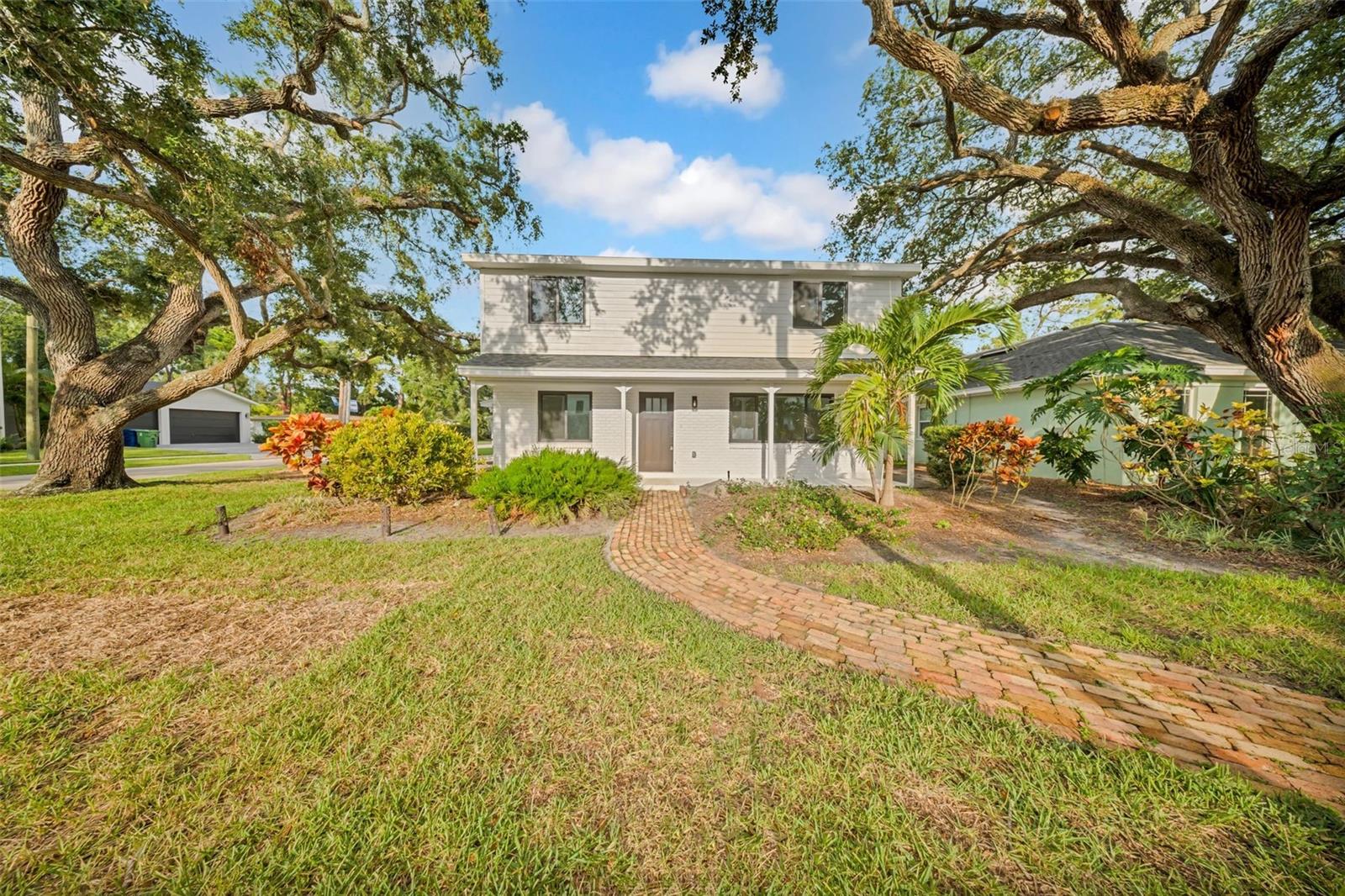 Traditional Charm Meets Modern Luxury! This beautifully renovated 2-story white brick and siding home (3BR/2.5BA, 1,945 sq. ft.) in the coveted Plant High district offers timeless curb appeal with every upgrade already completed. Inside, enjoy a bright kitchen/family room combo with quartz countertops, white shaker cabinets, new Samsung appliances, breakfast bar, dry bar, and farm sink. Luxury vinyl flooring flows throughout both levels, complemented by recessed lighting and PGT windows/doors. Additional features include a flex room, inside utility with a new washer and dryer, and a sealing system (flood gates) for flood prevention. Outside, relax by the resurfaced pool and enjoy the brick patio, green space, covered lanai, new lights, new irrigation system, and newly painted interior & exterior. A move-in ready blend of classic style and modern convenience, just minutes from Tampa International Airport, Westshore Business District, Downtown Tampa, Bayshore Boulevard, Hyde Park, Hospitals, Raymond James Stadium, Benchmark International Arena, and top-rated schools, shopping, and dining. Homes like this don’t last long, schedule your private tour today.