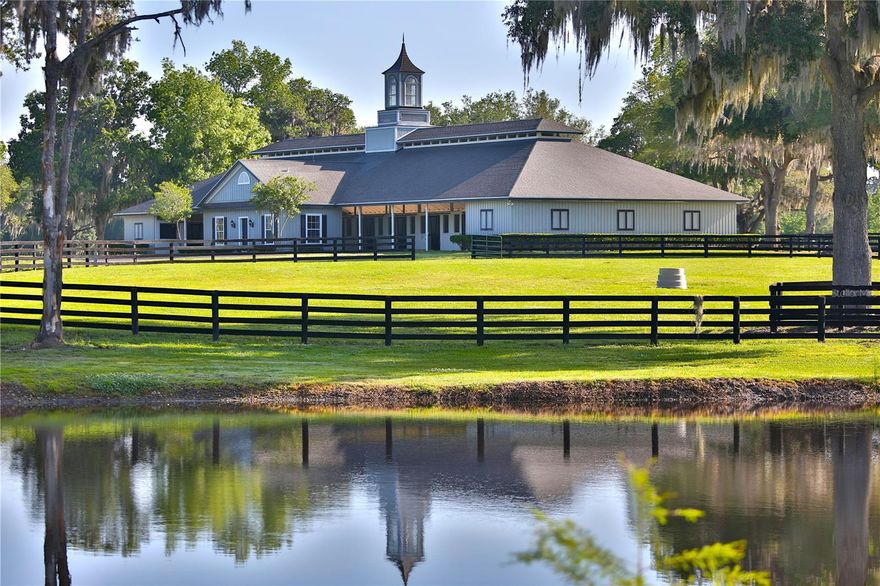 A fabulous opportunity to own 1,028 +/- acres of beautiful rolling hills graced with Granddaddy Oaks and ponds in NW Marion County.   4,000 +/ LF of road frontage on Hwy 318.  Property is currently being utilized as a cattle and horse farm, but if you have the vision to make it a family compound, or personal Valhalla Dreams do come true!   Main barn with office, break room and half bath has lab and viewing room (4) foaling stalls plus 16 additional stalls.    Five additional center aisle barns with 18-stalls each in 3 of the barns and 2 of the barns have 17 stalls each, plus office/break room and half bath.   2,280 +/- SF barn hay/storage building.   Approximately 22 miles of fencing which is a mixture of 4-board and diamond wire fencing with full round posts.  Located just 23 miles to World Equestrian Center, 11 miles to Williston Airport, and   12 miles to HITS.