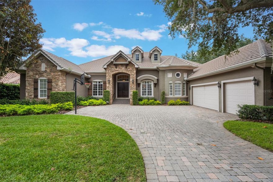 PRICE REDUCED $150K   This elegant single-story Rick Watson home, located at 6102 S Hampshire Court, Windermere, FL 34786, sits on a private Jack Nicklaus–designed golf course lot in the exclusive, 24-hour manned and gated community of Keene’s Pointe. Enjoy uninterrupted views of the 6th hole by day and Disney Fireworks at night from key living areas and the outdoor lanai. The home features 4 bedrooms, 5 bathrooms, a custom office, and a bonus room, anchored by a luxurious master suite with a sitting alcove, walk-in closet, and spa-like bath. The gourmet kitchen offers professional appliances, granite counters, an “invisible” walk-in pantry, and breakfast bar, while the custom office showcases fine woodwork and built-ins. Outside, a private resort-style heated pool and spa, summer kitchen, pavered lanai, and a state-of-the-art automatic mosquito misting system make outdoor entertaining effortless. The exterior is finished in stucco and stacked stone, with a 3-car side-entry garage and paver driveway. Ideally located in one of Central Florida’s most sought-after areas, the home provides access to top-rated schools, nearby hospitals, premier shopping centers, and is just a short drive to Walt Disney World and other major attractions, combining luxury, convenience, and lifestyle in one exceptional residence.