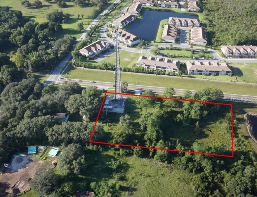 This vacant land tract in the ChampionsGate area has over 400' frontage on Bella Citta Blvd. and contains a perpetual easement for a communications tower. There is no residual income from the tower. The adjacent property on the corner at 1190 S. Goodman Road is also available - see listing R4902468.