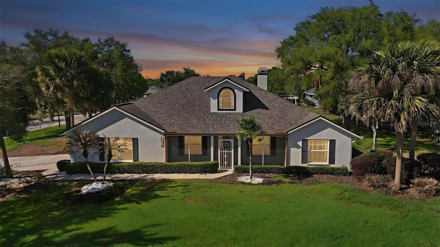 One or more photo(s) has been virtually staged. Situated on a desirable corner lot in Bright Water Place, this 3-bedroom, 2-bath home offers a light, open floor plan and limited views of Lake Eustis that can be enjoyed from the front porch and yard. A screened front porch welcomes you in and provides a relaxing spot to take in the peaceful setting. Inside, you’ll find a spacious layout featuring an oversized living room with a cozy gas fireplace, a dedicated dining room, and a versatile flex space ideal for a home office, playroom, or hobby room. The kitchen is equipped with a gas range, breakfast bar, and adjoining dinette for casual dining. A stunning 11 x 37 tiled Florida room lined with windows creates a bright and inviting space for year-round enjoyment, with French doors leading directly from the primary suite. The primary bedroom also features a large walk-in closet and an ensuite bath complete with a garden tub, separate walk-in shower, and private water closet. Tile flooring runs throughout the main living areas with carpet in the bedrooms, and the home also includes an inside laundry room, 2-car garage, and a fenced backyard. Bright Water Place offers a low annual HOA and fantastic community amenities including a private dock on Lake Eustis—perfect for fishing or enjoying the waterfront—as well as a playground. Boat ramps nearby provide easy access to the Harris Chain of Lakes, making this an ideal location for boating enthusiasts. Conveniently located near downtown Eustis, Mount Dora, shopping, dining, and major roadways, this home combines scenic charm with everyday convenience.