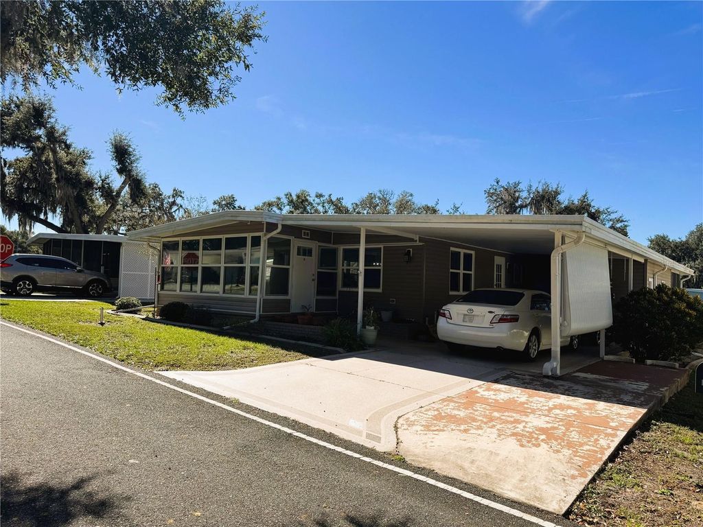 Photo of 105 Orchid Way, Leesburg, FL 34748 (MLS # R4910237)