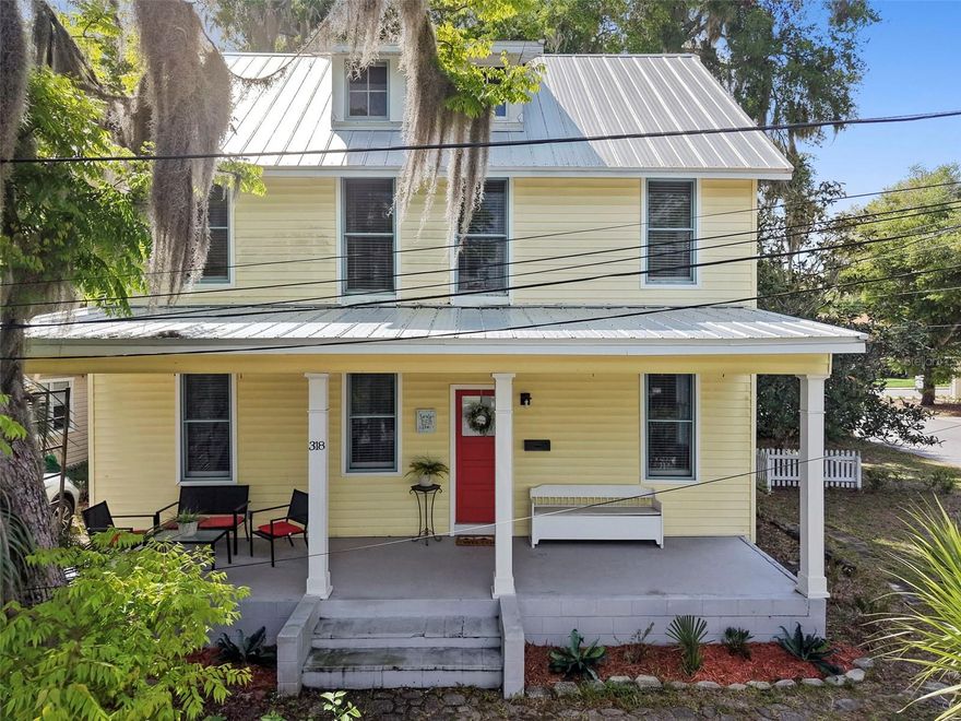 If these walls could talk, they’d have over a century of stories to tell. Tucked into Downtown DeLand behind a charming little white picket fence, this 1910 home carries that rare kind of character you just can’t recreate. Three full floors, five bedrooms, and three bathrooms give you the space, while the soul of the home does the rest. Step inside and you’re welcomed into the living room, with an electric fireplace. Just off to the right, the only bedroom on the first floor offers flexibility for guests, an office, or a tucked-away retreat. To the left, a full bath conveniently located outside the kitchen. Simple, functional, and right where you need it. The kitchen has its own story to tell, with a hidden-away laundry room just off to the side, complete with built-in shelving and access to the rear porch and patio, perfect for slipping outside with your morning coffee or winding down at the end of the day. Back through the heart of the home, the dining area connects it all and leads you upstairs to the second floor. Here you’ll find four more bedrooms, a centrally located full bath, and a second laundry area, because homes like this were built for real living & convenience. And then there’s the third floor. Unfinished, but far from forgotten. With a full bathroom already in place, this space is full of possibility, a studio, retreat, extra living space or loft. This isn’t just another house. It’s a piece of DeLand’s history waiting for someone who appreciates the character, the quiet corners, and the feeling that you’re part of something that’s been standing strong for generations. It's a place where past & present meet, and where the next chapter is waiting to be told.