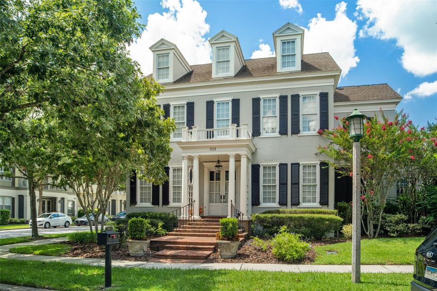 Welcome to Mulberry Park located across from the serene canals of Lakeside Park in the Home Business District of the Main Village of Celebration. A few highlights of this Classical architecturally styled home include intricate built-ins throughout, gorgeous second floor owner's suite featuring a porch and third story retreat, beautiful sunroom overlooking the garden courtyard and a carriage house. Perfectly situated on the corner of Mulberry Avenue and Front street in the Home Business District the home offers a multitude of possibilities. The owner can use the home as a residence, a residence with a business component or just as a place of business. Upon entry through the double door’s you are greeted by a lovely foyer and dining room with a coffered ceiling. Just off of the entry is a study which provides lovely pocket doors and built-ins. There is a bathroom off of the study next to a light-filled sunroom that over-looks the home's courtyard and has access from the home's side entry door. The kitchen is a wonderful space to entertain featuring cabinets that combine two finishes-heirloom on cherry and Lancaster cottage finish in a dark color with a brown undercoat, a butler’s pantry, desk area, gas range and lovely breakfast space. The living room features a heart pine mantel around the gas fireplace and a beautifully detailed ceiling. The guest apartment is over the garage and accessed from inside  the home. The apartment includes a full bathroom, kitchen and bedroom. The main second story of the residence is home to the owner’s suite, two additional bedrooms, full bathroom and study area. The owner's suite is an incredible space offering tranquil sleeping quarters with hardwood floors and provides access to a balcony overlooking the courtyard. The suite bathroom has double sinks, a soaking tub and separate shower. There is also a morning bar and large walk-in closet. The suite also has a third story offering an incredible retreat area with generous dormers offering plenty of light and detailed half moon window. The garden courtyard is a calming space and is overlooked by a large screened in side porch. The two car garage is attached to the house and has a driveway that accommodates two cars. There is also a carriage house with cathedral ceilings that can be accessed from Mulberry Avenue or the courtyard. This would be a wonderful space for an office, exercise room or studio. This is a rare and unique opportunity to own a home with so much potential less than 750 feet from Downtown Celebration.