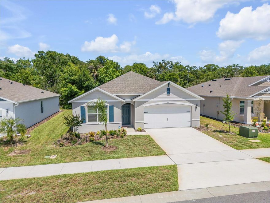 One or more photo(s) has been virtually staged. MUST SEE!! Like-new and barely lived in, this beautiful 4-bedroom, 2-bath home in the quaint community of Coronado Cove offers the perfect blend of modern comfort, low-maintenance living, and an outstanding central New Smyrna Beach location. With only 24 single-family homes in the neighborhood, Coronado Cove provides a quiet, cozy setting while keeping you close to everything NSB has to offer — schools, shopping, dining, everyday conveniences, and the beach are all just a short drive away. Featuring the popular one-story Cali floor plan, this home offers 1,882 square feet of bright, open living space with a functional layout designed for today’s lifestyle. The spacious living room, dining area, and kitchen flow together seamlessly, making the home ideal for entertaining, relaxing, and everyday living. The kitchen is beautifully appointed with quartz countertops, stainless steel appliances, a walk-in pantry, and a large center island overlooking the main living area. The split-bedroom design offers privacy and flexibility, with the primary suite tucked toward the rear of the home. The primary bedroom features a private ensuite bath with dual sinks, a separate shower, and a generous walk-in closet. Three additional bedrooms provide plenty of space for family, guests, a home office, hobby room, or whatever your lifestyle requires. The conveniently located laundry room is positioned near the bedrooms for everyday ease. Built with all-concrete block construction and equipped with smart home technology, this home offers peace of mind, efficiency, and modern convenience. The owners never fully moved in, giving buyers the rare opportunity to purchase a home that feels nearly brand new without waiting on new construction. Beachside fun, local restaurants, schools, shopping, and all the charm of New Smyrna Beach are nearby. Take advantage of this opportunity now — homes in small, centrally located neighborhoods like this do not come along often