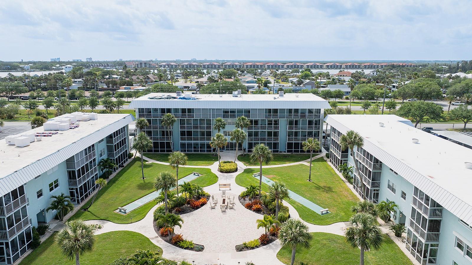 Welcome to WATERWAY EAST, a PREMIER WATERFRONT Community located on a DEEP WATER CANAL in the heart of New Smyrna Beach. Two bed, 2 bath, 2nd floor, End Unit with Marina Access! Combines Modern Convenience with Coastal Charm, all just a Short Walk from Flagler Ave, Canal Street, and the Sugar Sands Beach of New Smyrna. Other Highlights include Double Balcony with Water Views accessible from Living Room & Primary Bedroom and a wonderful Kitchen with Solid Maple, Soft-Close Cabinets, Slide-outs, and Granite Countertops. Tile flooring throughout. Laundry with new top-loading Washer & Dryer (in the unit). Ceiling fans in all rooms & Enhanced Kitchen Lighting. Convenient location near Elevator, Stairs, and Assigned Carport Parking. Community Features: Deep Water Canal Marina, 20 boat slips (up to 28 ft boats), Available for Rental (waiting list requirement), Fishing Dock, Fish Cleaning Station, and Kayak, Paddleboard, Canoe Racks at the waterfront . Clubhouse with Pool Table, Paddle Tennis, Full Kitchen, TV, and Library. Heated pool (winter months,) Gas fire pit & shuffleboard courts in beautifully Landscaped Courtyard. Indoor Bike Storage and Private Storage Unit included. Live the New Smyrna Lifestyle: Walk to the Beach, Local Restaurants, Boutiques, Art & Wine Walks, and Year-Round festivals. Be sure to check out our Video Tour!