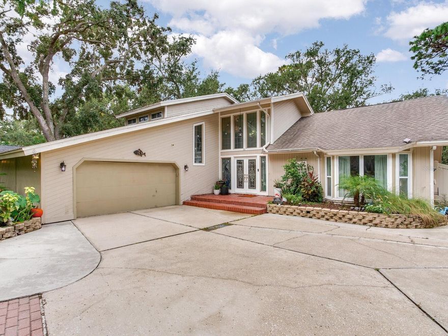 Welcome to 70 Bay Woods Dr — a distinctive residence located in the highly sought-after community of Bay Woods II, nestled in the charming town of Safety Harbor.

Safety Harbor is a golf cart-friendly city, just minutes from vibrant shops, restaurants, local festivals, the renowned Safety Harbor Spa, and the scenic waterfront park and marina. Enjoy the quaint small-town atmosphere while being conveniently close to Tampa International Airport, St. Pete/Clearwater Airport, and the world-famous Clearwater Beach and Honeymoon Island.

This multi-level split home showcases timeless character, beautiful woodwork, and soaring ceilings throughout. The expansive family room features a wood-burning fireplace, a 160-bottle wine rack, a minibar, and an 18-bottle wine cooler — perfect for entertaining family and friends. A spacious formal living room offers additional room for gatherings or quiet relaxation.

The backyard provides plenty of space to add a pool and backs up to a peaceful creek, creating a private, serene setting ideal for outdoor living.

Homes like this are a rare find in Safety Harbor. Schedule your private showing today and experience all that 70 Bay Woods Dr has to offer!