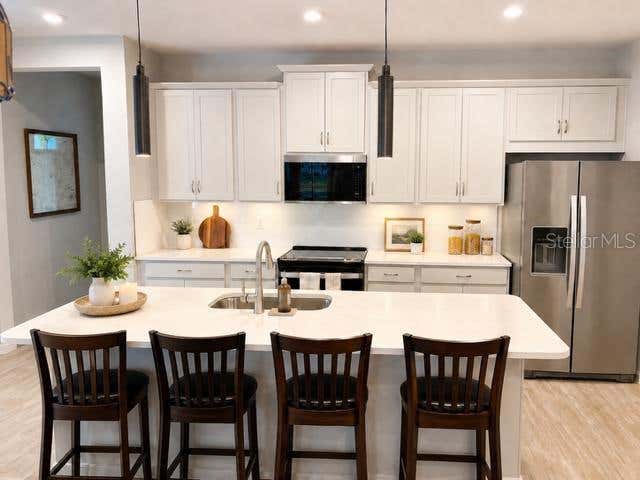 Photo of 6055 Timberdale Avenue, Wesley Chapel, FL 33545 (MLS # TB8533964)