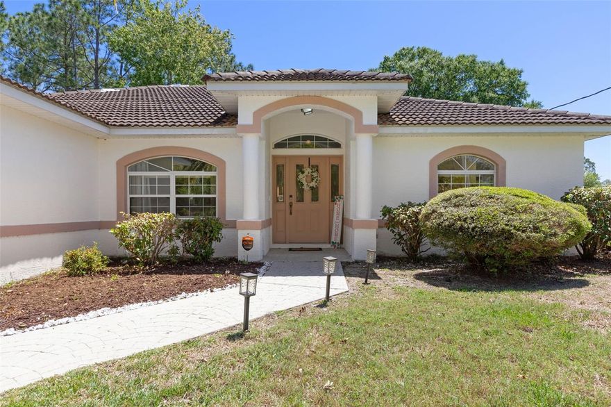 Stop the scroll: Welcome home to this charming 3-bedroom, 2-bath residence in a desirable Palm Coast neighborhood.  This home is ready for you to personalize and make it your own! Stepping inside, you are greeted by an airy, open atmosphere highlighted by soaring cathedral ceilings and a neutral palette that serves as the perfect blank canvas. The functional split floor plan offers excellent privacy for the primary suite, while ceiling fans throughout keep the home comfortable and cool. As an added bonus, the home includes two convenient Murphy beds, providing flexible space for guests or a home office.

This home is built to last with concrete block and stucco construction, a durable tile roof, and a stamped concrete driveway. A major highlight is the expansive backyard—a vast private oasis with plenty of room to add a pool. Best of all, this property comes with the freedom of no HOA or CDD fees. To ensure a smooth transition, the seller has already had a 4-point inspection completed, providing you with added peace of mind.

Located on a peaceful street near paved walking trails and just 7–8 miles from the area's stunning riverfront and oceanfront parks, this home offers an unmatched Florida lifestyle. You are minutes from essential shopping, dining, and medical facilities, with a quick 30-minute drive taking you to the charm of historic St. Augustine or the excitement of Daytona Beach. Whether you are looking for a move-in-ready residence or a smart property with room for your vision, this home is your gateway to the best of Palm Coast.

Highlights:

3 bedrooms, 2 bathrooms with a functional split floor plan.

Soaring cathedral ceilings and neutral finishes.

Includes two versatile Murphy beds.

Expansive backyard with room for a private pool.

Solid concrete block/stucco construction with a tile roof.

Seller has completed a 4-point inspection for your peace of mind.

No HOA or CDD fees.

Conveniently located near beaches, trails, and medical facilities.