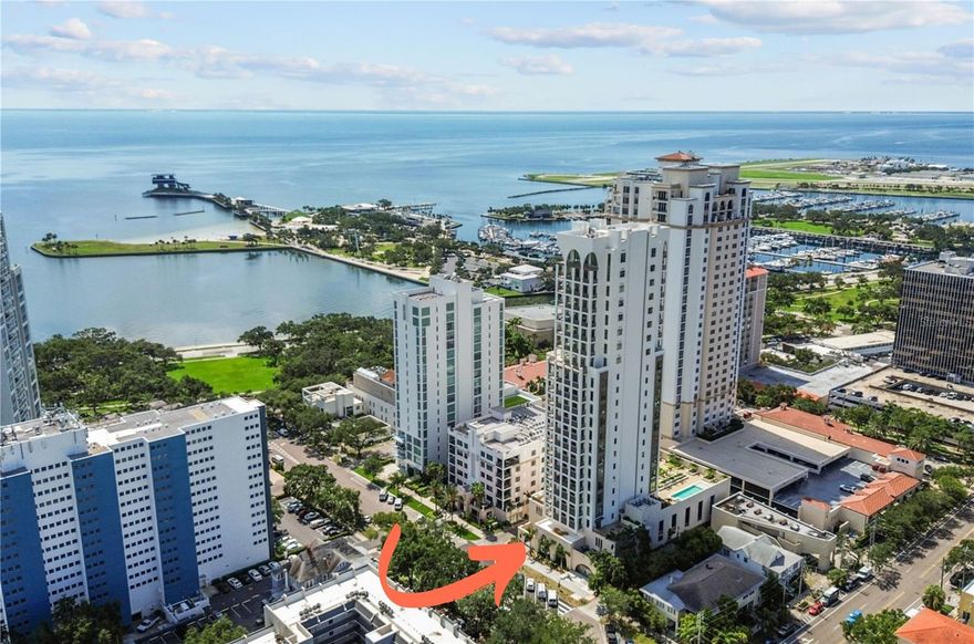 One or more photo(s) has been virtually staged. Experience refined contemporary living at The Nolen, an exclusive 23-story boutique condominium in downtown St. Petersburg, offering only 31 private residences. This brand-new, north-facing residence features 3 bedrooms and 3 bathrooms across 2,156 square feet of thoughtfully designed, contemporary living space. A private elevator opens directly into your own dedicated foyer, leading to a stunning corner residence with no shared walls and expansive floor-to-ceiling, impact-rated, energy-efficient windows that frame both city and water views, including the historic Old Northeast, the Vinoy, and the shimmering expanse of Tampa Bay. The Nolen introduces a new level of luxury, functionality, and sustainability. As an NGBS-certified green building, it features a comprehensive whole-building generator providing emergency power to all residences and an integrated water softening system throughout. Inside the home, you’ll find 10-foot ceilings, LED lighting, solid core doors, gold-toned hardware, laundry room with full-size Electrolux washer/dryer with utility sink and cabinetry, and engineered hardwood floors in the main living areas and porcelain tile in all bathrooms. This residence includes nearly $100,000 in upgrades with Haven Smart prewiring for A/V automation, lighting control, security, audio, and WiFi access points, along with sleek, high-end Lutron Mirage automated shades (both blackout and light-filtering). The advanced wiring infrastructure includes 1x shielded Cat-6, 2x Cat-6, 2x RG6, and additional connections tailored to specific zones. The chef-inspired kitchen boasts cabinet-paneled Thermador appliances, an induction cooktop, under-counter wine fridge, Cambria quartz waterfall island, and a granite farmhouse sink. The serene owner’s suite features a spa-like bathroom with a freestanding soaking tub, oversized walk-in shower, Brizo fixtures, TOTO toilets, and a striking designer tile feature wall. Step outside to the 38-foot-long private terrace, extending from the living area to the primary suite—perfectly positioned for enjoying both city and sunset views. Residents enjoy access to a beautifully designed 4th-floor amenities level, which includes a club room, state-of-the-art fitness center, saltwater pool and spa, shaded cabanas, outdoor kitchen and BBQ area, and cozy fire pit lounges. With concierge service, a dedicated on-site property manager, and a truly all-inclusive offering—everything described is included with no upgrade charges—The Nolen provides an elevated, maintenance-free lifestyle. Additional features include two assigned parking spaces, both pre-wired for EV charging, and a large climate-controlled private storage room directly in front of one space—an absolute rarity and true luxury in downtown St. Petersburg. Perfectly positioned for walkable access to St. Pete’s acclaimed Beach Drive, restaurants, galleries, museums, parks, and waterfront attractions, The Nolen is where modern luxury meets timeless charm.