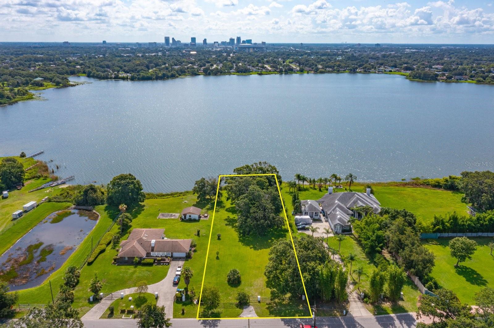 Welcome to your future oasis at 223 S Ortman! Nestled on a tranquil street, this 1.88-acre lakefront lot offers the perfect blend of privacy and convenience. As an added bonus, this NO HOA community is surrounded by established homes.
Located just minutes from the heart of Downtown Orlando, this hidden gem sits within the city limits while offering the serenity of your own secluded retreat. You'll enjoy urban accessibility without sacrificing the peaceful lakefront lifestyle you've been dreaming of.
Build your dream estate or modern masterpiece on this expansive lot featuring breathtaking lake views and abundant space for all your vision requires. Whether that's a resort-style pool, charming guest house, flourishing gardens, or your own private dock. The possibilities are truly endless.
Whether you're looking to create a luxurious family compound or a peaceful sanctuary close to major highways. This property delivers unmatched potential in a rarely available location. Don't miss this opportunity to own your piece of lakefront paradise in the city.