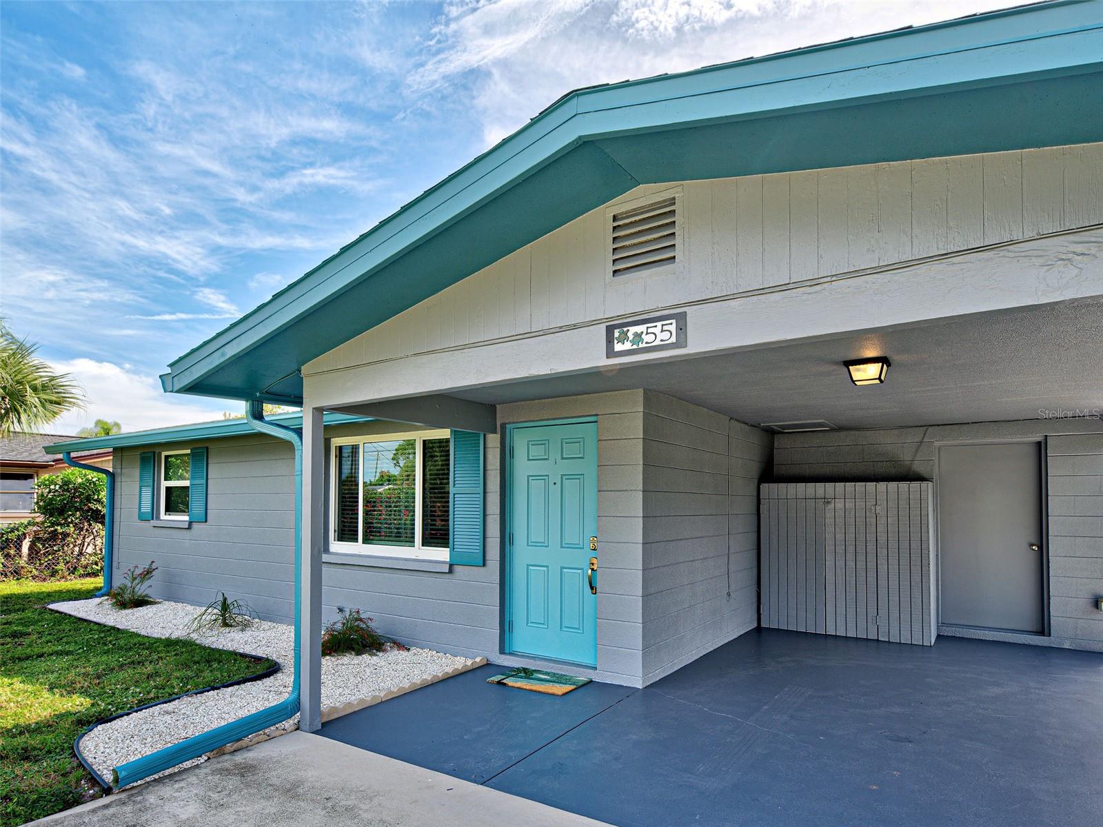 Enjoy the charm and character of this delightful coastal inspired piece of paradise!
The heart of the home is bright and inviting with the perfect blend of coziness & comfort. Luxury vinyl flooring adds warmth and elegance throughout the entire home. Kitchen features shaker style white cabinetry, smooth top stove, microwave and a stainless-steel refrigerator. This home features two bedrooms with a centrally located bathroom that offers a tub and shower combination for your convenience. Updates include fresh interior & exterior paint 2025, New kitchen appliances 2025, Impact Windows in 2022, new AC in 2023, Electrical Service update in 2019 and Roof Replacement in 2017. Practicality meets versatility with an interior laundry room with room for storage. The large backyard is a true oasis, fenced & shaded by two large trees! Imagine peaceful moments in your covered screened-in lanai—perfect for reading & relaxation, outdoor dining or even just watching the squirrels! The property is hooked up to central water & sewer, eliminating the need for all those expensive water treatments & maintenance that goes along with well & septic. Did I mention the Driveway? It’s 16 feet wide and long enough to accommodate 2-3 vehicles! Visit this home today & make it yours! Some Living & Bedroom photos have been virtually staged.