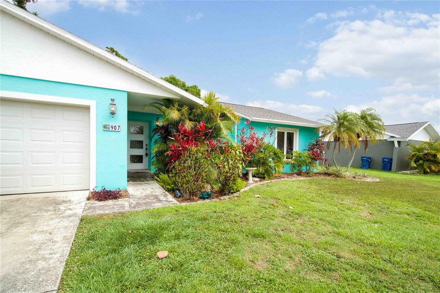 Imagine waking up to the sun glistening off the water as you enjoy your morning coffee on a charming enclosed patio. Nestled in one of Bradenton’s most sought-after school districts, 907 69th St NW offers the rare gift of space to grow and the peace of mind that comes with sustainable living. Why choose between the beach and the city? You are a quick 10-minute drive to the turquoise waters of Anna Maria Island, yet you can walk to Target, Publix, Starbucks, and local dining whenever the mood strikes.
This versatile floor plan features 3 spacious bedrooms and 3 bathrooms, plus a private office with French doors overlooking the water (easily used as a 4th bedroom). For quiet moments, retreat to the cozy sitting area featuring custom built-ins and a picturesque bay window. Have toys? Bring the boat, trailers, and extra vehicles—the oversized side yard, 2-car garage, and large driveway provide ample parking for everything you need to enjoy the Florida lifestyle.
While others face rising utility costs, you can keep this home a crisp 67–72°F and enjoy electric bills as low as $20–$100 thanks to the fully owned Solar Power system. This home is packed with high-end upgrades:

Purity: A whole-house Halo filtration system for pristine water from every tap.
Efficiency: Newer hybrid water heater and high-efficiency air handler.
Savings: A dedicated irrigation pump draws from the pond to keep your tropical landscape vibrant for free.

Step into a backyard designed for the modern family. Harvest vegetables from your raised garden beds and collect fresh eggs from your private chicken coop. Whether you’re gearing up for a day on the island or hosting a dinner gathering, this is the spacious sanctuary your family has been waiting for.

Lakefront views. Top-tier schools. Sustainable savings. Welcome home