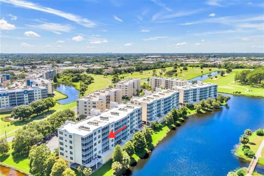 One or more photo(s) has been virtually staged. Come experience resort-style living at its finest with NO WORRIES about hurricane impacts—these condos are both ELEVATED and built with SOLID CONCRETE CONSTRUCTION for maximum security and peace of mind! Milestone Inspection Studies are 9 years away, and the SIRS (Structural Integrity Reserves Study) has been completed for Building Six, confirming it is in excellent financial and structural condition with NO planned assessments.



This move-in ready 2-bedroom, 2-bathroom condo offers breathtaking panoramic views of the serene lake, lush golf course, and vibrant Florida sunsets. Inside, you’ll find freshly painted throughout open-concept living room, dining area and brand new Luxury Vinyl Plank flooring throughout. The kitchen has newer appliances. Designated parking space conveniently located out front of the building



The west-facing 140 sq ft covered and screened balcony is accessible from both the living room and primary suite—perfect for enjoying sunsets and year-round outdoor relaxation.



The expansive primary bedroom retreat offers his-and-hers walk-in closets, a luxurious ensuite bathroom with double vanities, an oversized walk-in shower and a private toilet closet. A split-bedroom layout ensures privacy, and the versatile second bedroom easily accommodates guests, a home office, or a combination of both. Additional conveniences include an in-unit laundry closet.



A new roof was completed last year, and the low HOA fee includes PROPERTY INSURANCE, cable, internet, water, exterior maintenance, and more.



Residents enjoy a heated pool, hot tub, resort-style clubhouse with kitchen and meeting room, and pet-friendly policies (2 pets up to 25 lbs for owners only). Minimum rental period is 3 months, making it ideal for primary residence, seasonal living, or investment income.



Best of all, East Bay Golf Course is right outside your door—NO country club membership required—and you’re just 10 minutes from the sugary sands of the Gulf beaches, close to restaurants, shopping, and a quick drive to Tampa or St. Pete.



This is resort living made easy in a quiet, desirable Pinellas County community. Don’t miss your chance to live your best Florida lifestyle!