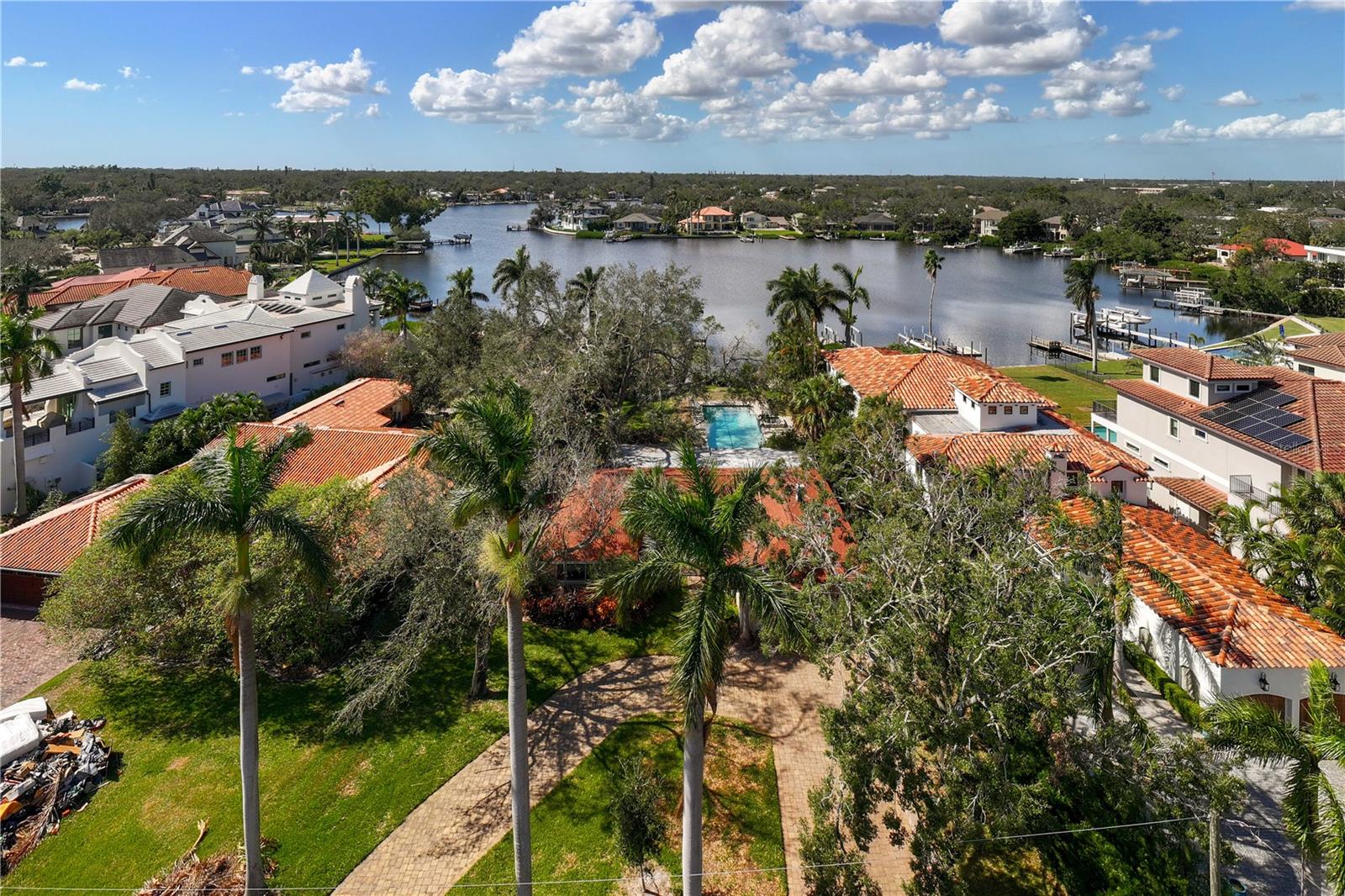 Seize the opportunity to build your dream luxury home in the prestigious Snell Isle neighborhood, where magnificent residences line the Coffee Pot Riviera brick street. This stunning .4-acre waterfront lot on Coffee Pot Bayou offers the ideal canvas for your architectural vision. Please note this property was impacted by flooding from Hurricane Helene and has not been remediated. It is being sold as-is for land value, allowing you to create a custom home tailored to your desires. Imagine designing a home that complements the breathtaking surroundings, complete with an extra-large pool for relaxation and entertainment. The new composite dock provides easy access to the water, allowing you to enjoy boating and fishing from your backyard. The property is adorned with mature trees, adding character and shade to your future outdoor oasis. Experience gorgeous sunsets that paint the sky in vibrant hues, while manatees, dolphins and an array of marine life grace your waterfront oasis. This is more than just a property. It’s a lifestyle defined by luxury, tranquility and natural beauty. Don't miss your chance to join the ranks of other magnificent homes in this iconic neighborhood. Contact us today to explore this exceptional opportunity and start envisioning your future in Snell Isle!