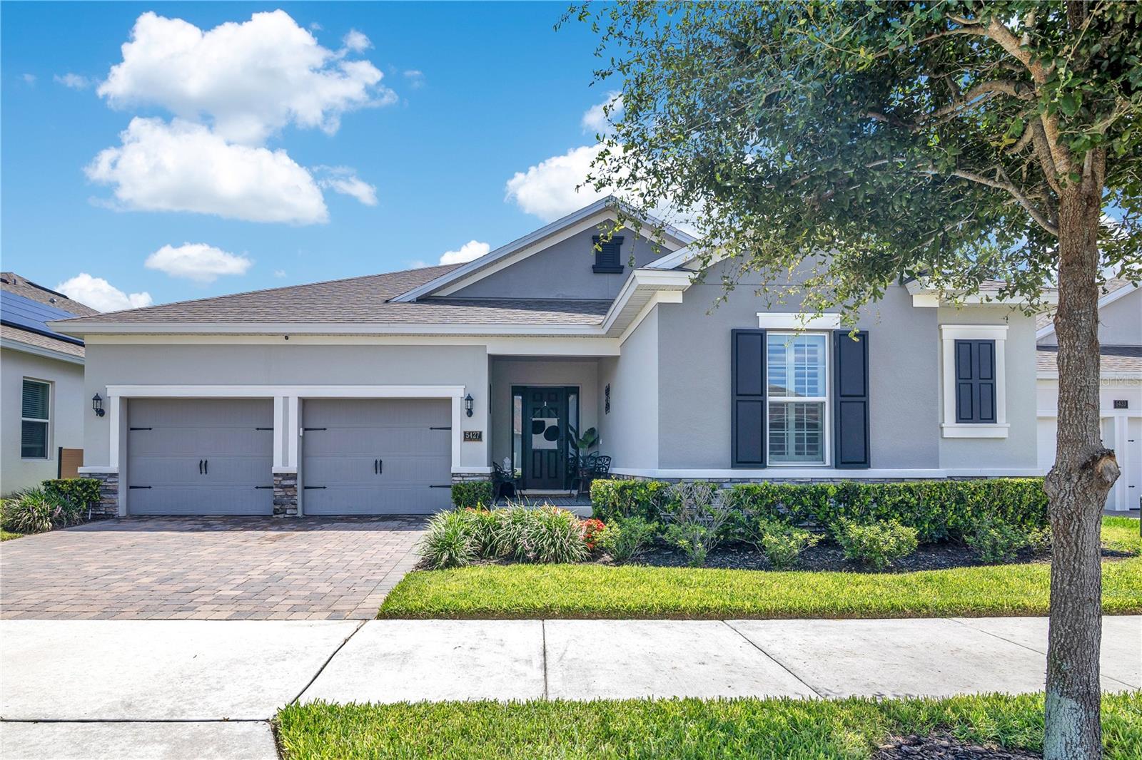 Welcome to this beautifully upgraded 4-bedroom, 4-bath home located in the highly sought-after Wincey Groves community in Winter Garden. This thoughtfully designed residence features a functional 3-way split floor plan, offering abundant flexible space including a massive upstairs loft and a dedicated bonus room currently used as a home gym with luxury vinyl flooring.
The modern interior impresses with a stunning stone accent wall in the main living room and recessed lighting throughout. The gourmet kitchen is a chef’s dream, showcasing granite countertops, a farmhouse sink, and an open layout perfect for entertaining guests.
Additional standout design elements include a disappearing glass sliding door that opens to a screened-in patio, a unique ceiling fan in the living area, custom wallpaper in the bedrooms, and ceiling fans in every bedroom. Enjoy privacy with no rear neighbors and a backyard pre-wired for a pool, ready to become your personal oasis.
Other premium features include epoxy flooring in the garage, removable tile in the front entryway and back patio, window shutters in the guest and Jack & Jill bedrooms, and a privacy window in the primary bathroom. The driveway comfortably accommodates two vehicles.
Wincey Groves is known for its tree-lined streets, charming community layout, and proximity to top-rated schools, shopping, and dining. Conveniently located near Hamlin Town Center, Horizon West, and major roadways, this home offers both comfort and exceptional accessibility.
For added value, the living room furniture and the primary bedroom furniture are also available for sale separately, providing flexibility to purchase them individually if desired.