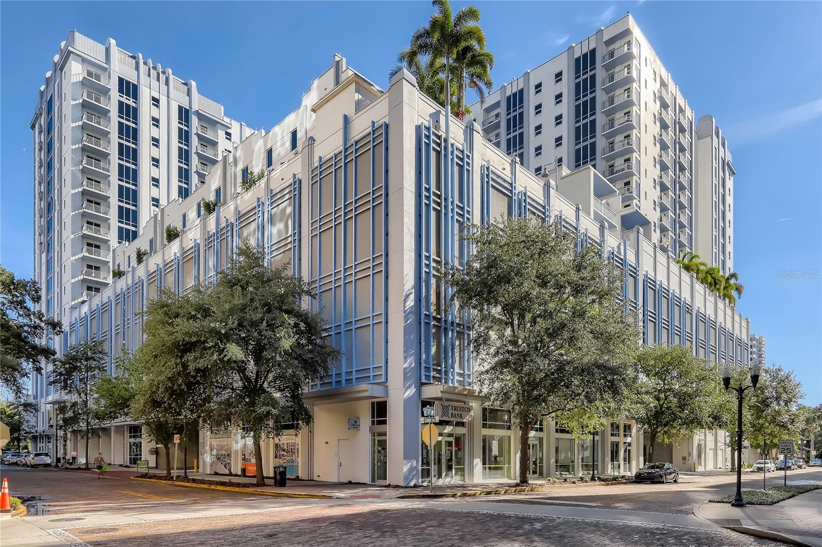 Rare Villa Townhome with Private Elevator on the Pool Deck – Paramount on Lake Eola
Introducing one of the most exclusive residences at Paramount on Lake Eola — a stunning pool deck-level villa townhome offering the perfect blend of private luxury and resort-style living in the heart of Downtown Orlando. With its own private elevator, soaring 9-foot ceilings, and premium designer finishes, this two-story residence lives like a private home with all the benefits of high-rise living.
Step into an open-concept layout featuring wood-style plank flooring, espresso cabinetry, quartz countertops, and a gourmet kitchen with stainless steel appliances ideal for entertaining or quiet evenings at home. Floor-to-ceiling windows bring in natural light and frame your view of the lush, amenity-rich pool deck, just steps from your front door. Enjoy seamless indoor-outdoor living with immediate access to poolside cabanas, gas grills, and the club lounge... all just outside your villa.
Upstairs, retreat to spacious bedrooms with walk-in closets, a spa-inspired bathroom, and a sense of privacy rarely found in high-rise properties. The in-unit washer and dryer, smart home technology package, and dedicated storage unit add functionality and ease.
Located above Publix Urban Market and surrounded by premier dining and cultural venues along E Central Blvd, this villa offers unmatched walkability and convenience. Take a morning jog around Lake Eola Park, stroll to the Walt Disney Amphitheater, or catch the sunset over Orlando’s skyline from your private retreat.
Whether you’re seeking a stylish downtown home or a lock-and-leave luxury escape, this Paramount villa is a rare opportunity to own one of the building’s most coveted and unique floorplans.