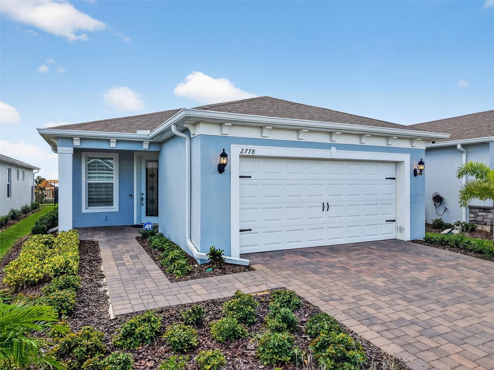 **Move-In Ready Home!** Welcome to a harmonious blend of nature's beauty and vibrant living in the charming city of Minneola. Here, you'll discover Del Webb's active adult communities, thoughtfully designed for those aged 55 and over who seek an engaging and fulfilling lifestyle. Each day presents an opportunity to enjoy serene views, participate in a variety of community activities, or explore the rich cultural and entertainment options that Central Florida has to offer. This stunning home, completed in 2024, is ready for its new owner. With a 10-year builder warranty that is transferable, extensive upgrades totaling $ 49,165.00 (excluding the lot premium), and premier amenities, it’s the perfect place to embark on your next chapter. Perched on a hill, the property overlooks the lake, allowing you to enjoy breathtaking sunrises every morning from the screened-in lanai with automatic shades. Imagine waking up each day to the sun rising over the lake and hills—a delightful way to start your day! Built with numerous enhancements beyond the standard builder package, this home features a formal entryway that welcomes you into the Contour model. The design showcases views of the spacious gathering room and a kitchen equipped with a large island. The efficient, open floor plan with luxury vinyl provides ample dining areas, making everyday living and entertaining a breeze. Notable upgrades include a kitchen package with 42-inch shaker cabinets topped with luxurious white quartz, along with a built-in gas range and oven that enhance comfort and functionality. Residents of our 55+ community enjoy an exceptional lifestyle beyond the comforts of home, starting with a manned gated entrance for added security. A high-speed internet and TV package is included in the HOA, making it easy to stay connected. Nestled atop Sugarloaf Mountain, this community offers breathtaking views extending to Lake Apopka and Downtown Orlando. Indulge in resort-style amenities, including a state-of-the-art clubhouse featuring an on-site bar and grill. The outdoor pool and spa, fitness center, and movement room provide numerous opportunities for wellness and relaxation. Social engagement is encouraged through tennis and pickleball courts, a community garden, and multipurpose rooms. Our lifestyle director organizes a variety of activities, including wine tastings, culinary events, and yoga sessions. The surrounding area of Minneola is a haven for outdoor enthusiasts, with access to premier golf courses such as Mission Inn Resort, Bella Collina, and Green Valley Country Club. Residents can explore the Lake Minneola Scenic Trails, enjoy boating and fishing on the Clermont Chain of Lakes, or relax at Veterans’ Memorial Park. The vibrant social scene in nearby Historic Downtown Clermont, Lakeridge Winery, and the upcoming Hills City Center offers endless entertainment, shopping, and dining options. For your peace of mind, convenient healthcare access is available at nearby hospitals such as AdventHealth Waterman and Orlando Health South Lake. This home is a rare gem, combining luxury, privacy, and an unparalleled community lifestyle. **Schedule your private tour today!**