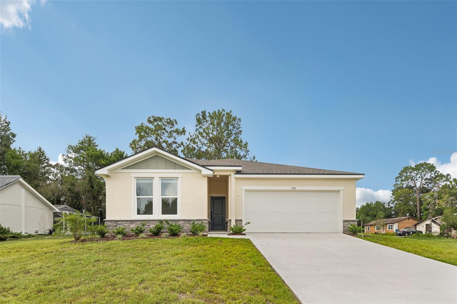 Stunning new construction home Spring Hill, Florida. This single-story floorplan offers 3 bedrooms, 2 bathrooms, 2 car garage - open floor plan
Enjoy the upscale Executive Package, featuring 9’ ceilings, tall interior doors, and modern finishes throughout. The open-concept living area is filled with natural light and flows seamlessly into the upgraded kitchen, which includes built-in stainless steel appliances, quartz counter tops
The private owner’s suite features a spacious bedroom, oversized closet, and a luxurious ensuite bath with dual sinks and a large shower.
Two additional bedrooms are thoughtfully placed to provide privacy and functionality. Enjoy vinyl plank flooring in main living areas, plush carpet in bedrooms, and beautiful fixtures throughout. This home sits on a highly desirable oversized lot.
Located just minutes from Tampa, this new home in Spring Hill offers style, comfort, and modern design in a growing area with No high HOA or CDD fees = NO Restrictions!