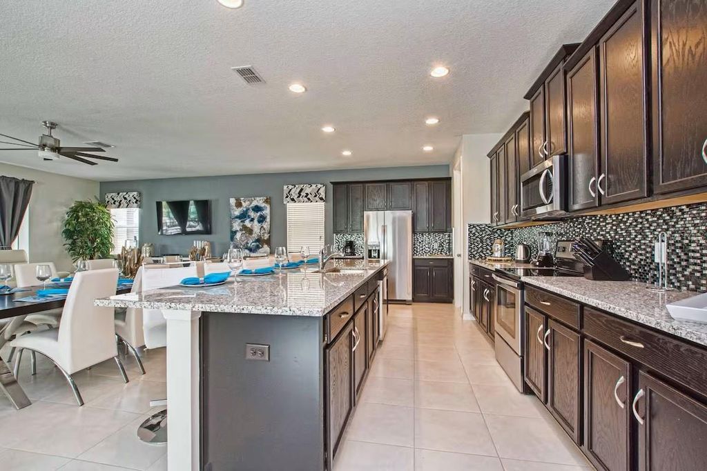 Photo of 9015 Sunshine Ridge Loop, Kissimmee, FL 34747 (MLS # O6371288)