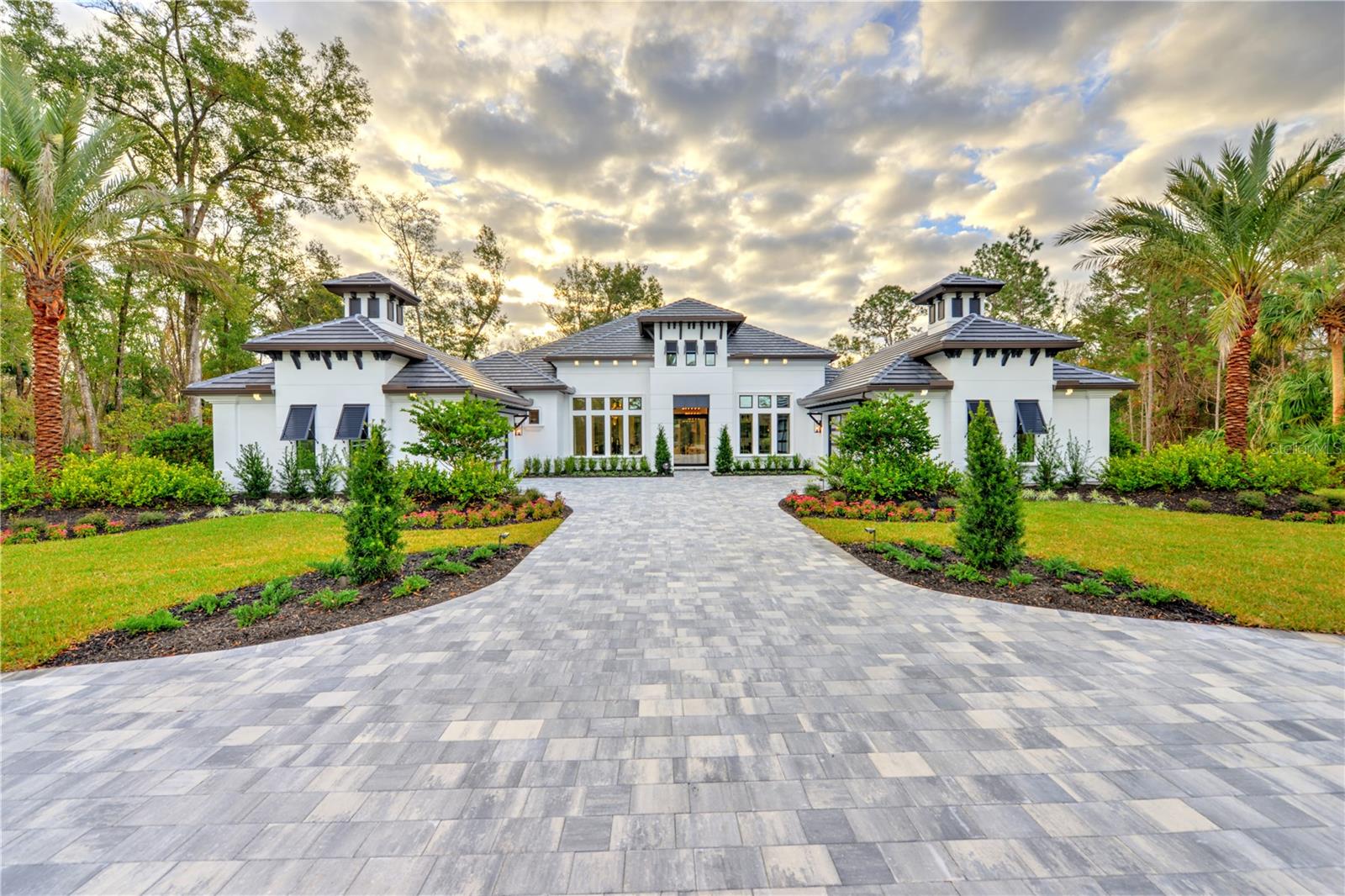 Awarded the 2025 Showcase Home for the VBIA Parade of Homes. This fully furnished model is now available for sale; furnishings available separately. Expertly designed with every detail thoughtfully curated, each element of décor and furnishing was hand-selected to create a truly exceptional living experience. Experience unparalleled luxury in this brand-new ICI Homes custom estate home, set within an exclusive gated community designed for those who value privacy, nature, and prestige. Nestled on a sprawling 1.7-acre homesite backing up to protected conservation land, this exquisite model home is a masterpiece of modern design. At the heart of this award-winning floor plan, the open-concept living area seamlessly connects the kitchen, living room, and nook—creating the perfect space for both entertaining and everyday living. The chef's kitchen is a true showpiece, featuring an alternative kitchen island for a contemporary touch, ample counter space, and a hidden pantry for extra storage. The master suite is a private sanctuary, boasting elegant architectural ceiling details, dual walk-in closets, and a spa-like bath complete with a soaking tub and separate shower. Walls of 10' tall corner sliders blur the lines between indoor and outdoor living, leading to a breathtaking backyard oasis. Enjoy an infinity pool and spa with fire bowls, a serene privacy garden, and a cabana with a fully equipped outdoor kitchen perfect for year-round entertaining. Additional features include soaring 14' to 16' ceilings, polished porcelain tile floors, a luxurious wine bar, and a spa-inspired steam shower. A rare opportunity to own a custom-built estate in a premier location, this home offers an exceptional blend of sophistication and tranquility. The Estates at Brown's Landing, where luxury meets history, and your custom dream home awaits. Nestled in the acres of preserved natural beauty, this community is a serene retreat rich in heritage dating back to the 1800's. Portions of the original family-owned orange grove from the 1930s still stand, with several orange trees continuing to blossom and bear fruit, serving as living reminders of the estate's storied past. Additionally, the community preserves several historic oaks and others that have stood for generations, protected and carefully integrated into the organic landscape. These majestic trees not only provide shade and charm but connect the present with Florida's enduring past, making The Estates at Brown's Landing a place where history, nature, and elegance intertwine. Leaseback Option is also available.