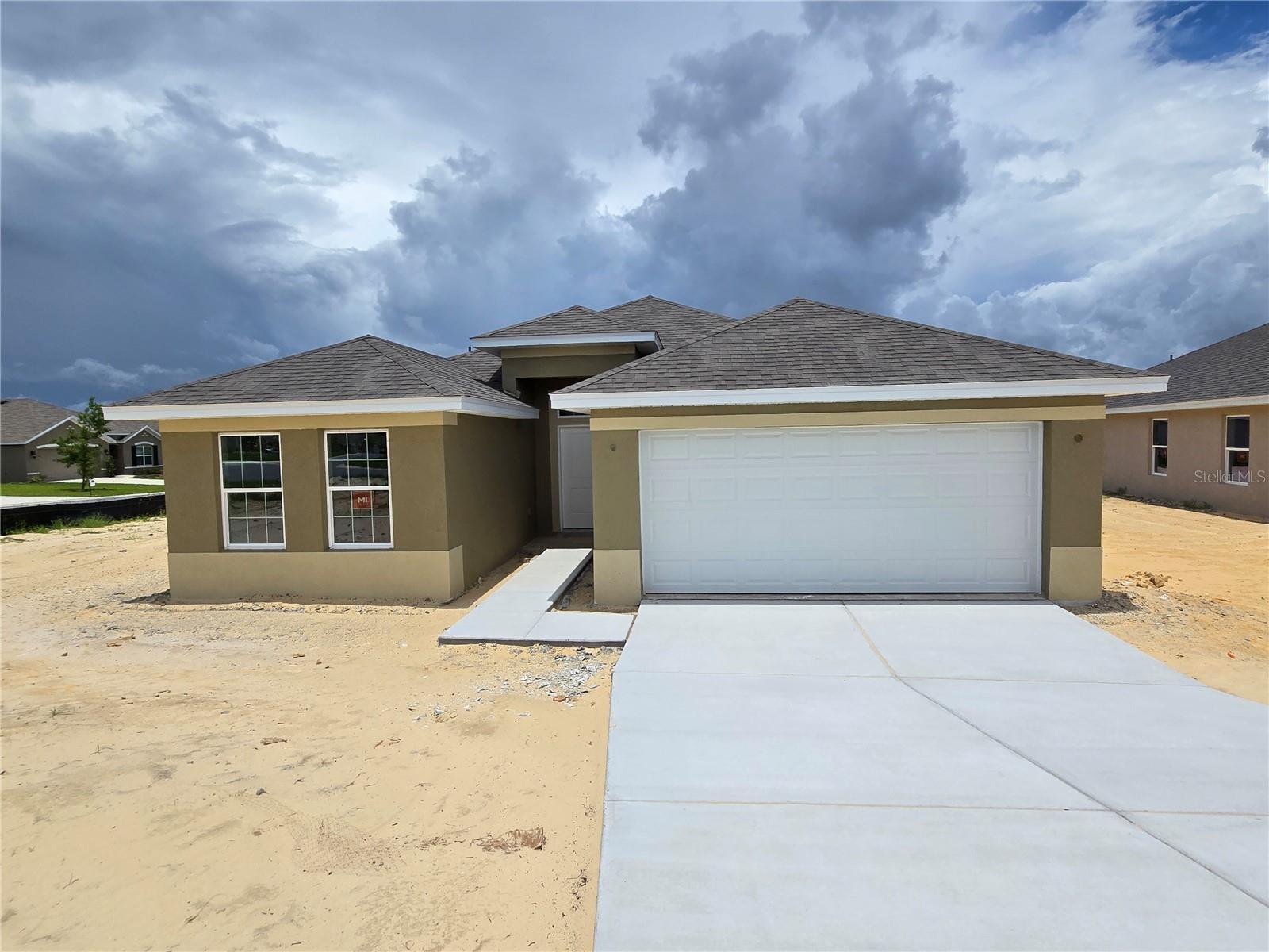 Under Construction. Seller's Promo, up to $10,000 flex money for interest rate by-down and pre-paid items. This corner lot in a cul-de-sac sits at one of the highest elevations of the property. This 2000 sq ft home is very popular with vaulted ceilings, 4 bedrooms, 2 bathrooms and 2 car garage including a large, covered lanai. This beautiful home includes dining room, kitchen with a large island and breakfast nook. The primary bedroom has 2 walk-in closets and an ensuite with tiled shower. The secondary rooms are spacious with lots of natural lighting. This is a must see, stop by the model at 683 W Rexford Drive, Beverly Hills, FL 34465 for more information or text listing agent to set a tour. I can't wait to see your reactions.