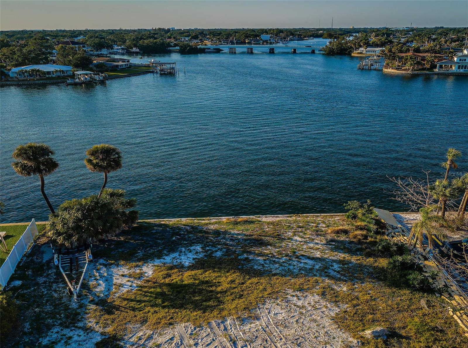 Located on beautiful water in a terrific Snell Isle community, this vacant waterfront lot boasts a wide 108 of water frontage. Build the large-scale home of your dreams on a lot with a generous 135ft of depth. Protected from the elements of open Tampa Bay, Smacks Bayou is an ideal location for your boat and for various water sports. Enjoy sweeping waterviews that never grow old and boat to open Tampa Bay in less than 5 minutes. Situated near exceptional schools, dining, shopping and the entertainment of downtown St. Pete – you are just minutes from everything you’ll need to live the waterfront lifestyle! An exceptional waterfront lot located in highly-sought-after Snell Isle.