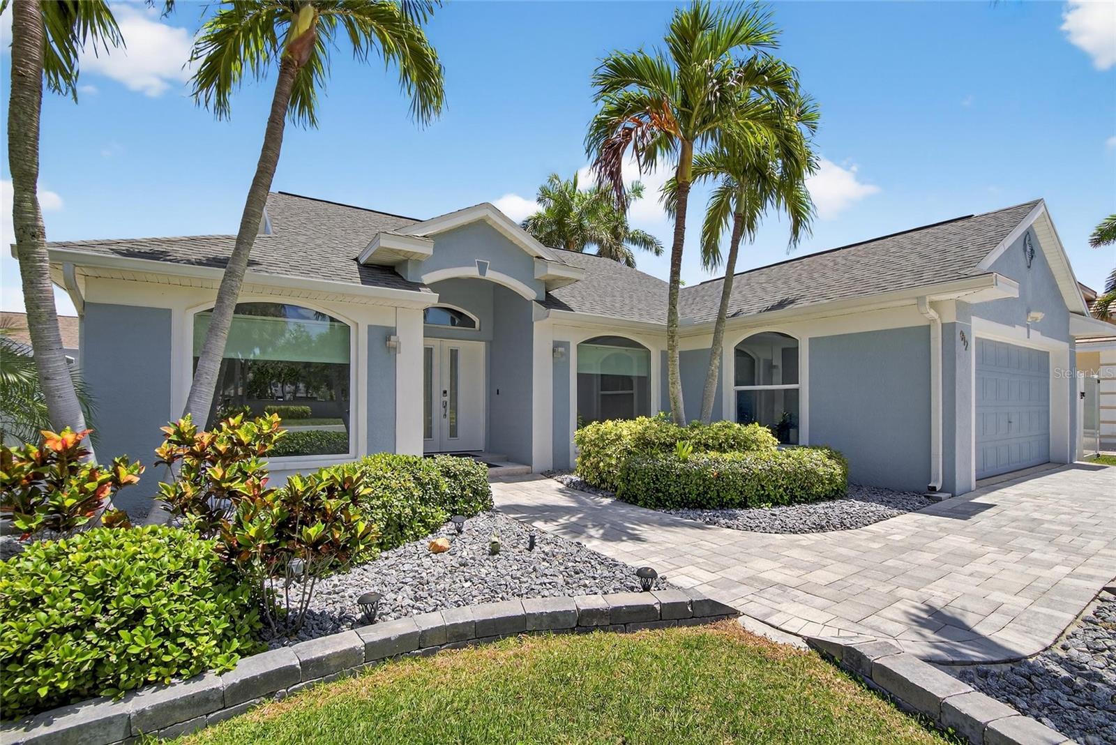 Stunning Tierra Verde Rental – Designer 4-Bedroom Home - Live the island lifestyle in this beautifully designed 4-bedroom, 2-bath home located in the close-knit Tierra Verde community. Just minutes from Ft. DeSoto Park, Shell Isle, and favorite local pubs and restaurants, this property blends comfort, convenience, and style. Step inside to a spacious open-concept great room featuring a high-end kitchen and seamless flow to the outdoors through triple-sliding glass doors that open to your private fenced courtyard. Separate dining and living areas provide endless options for entertaining and relaxing. The primary suite is a true retreat with multiple closets (walk-in, reach-in, and linen) and a spa-like bath with dual shower heads and a private toilet alcove. Three additional bedrooms offer generous closet space and natural light, while the hall bath provides abundant storage and a full tub-shower. A separate laundry room with Samsung appliances and a spacious two-car garage with keypad entry add convenience. Lease Terms include minimum 7-month lease and Tenant is responsible for utilities and renter’s insurance. No pets permitted. The Island Grill (less than one mile away) offers pool wristband(s) for $7 daily (11 a.m.-dusk); food and drinks can be ordered at the Tiki Bar or regular outdoor bar and enjoyed at the pool.